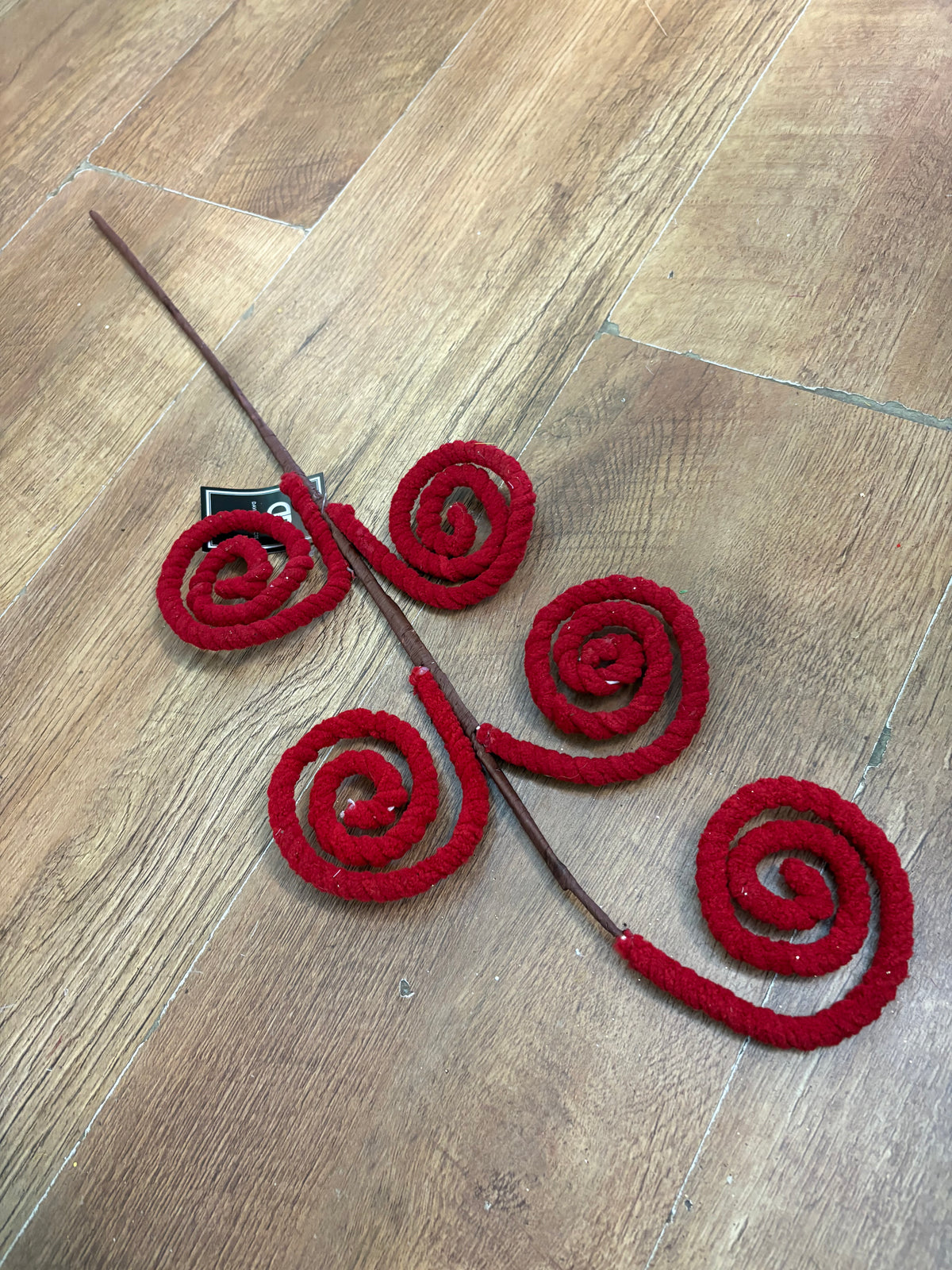 Long stem fluffy red swirly stem