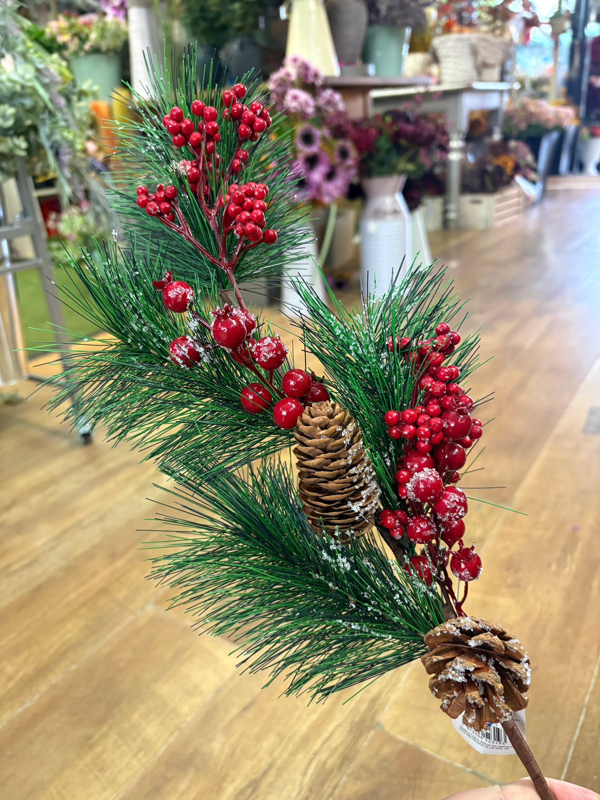 Long stem frosted foliage wi5 cones and mixed berries