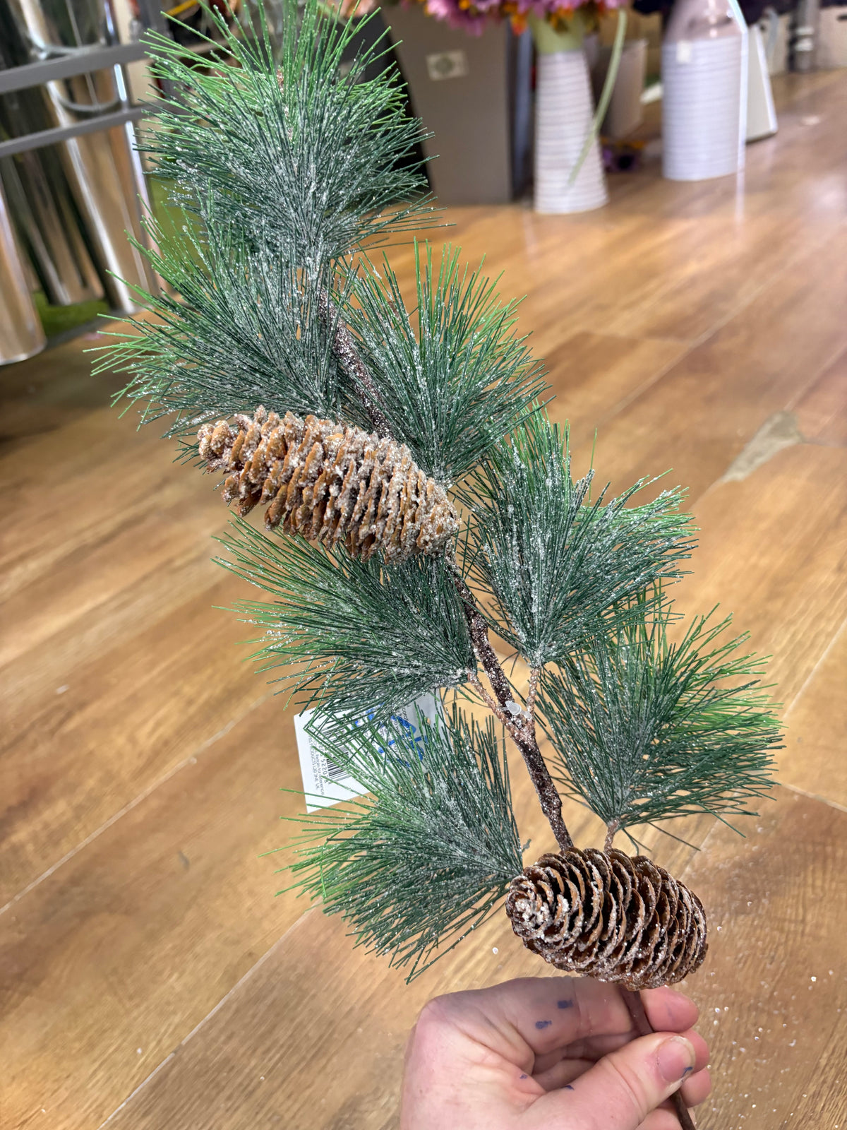Long stem frosted and glittered winter foliage with cones