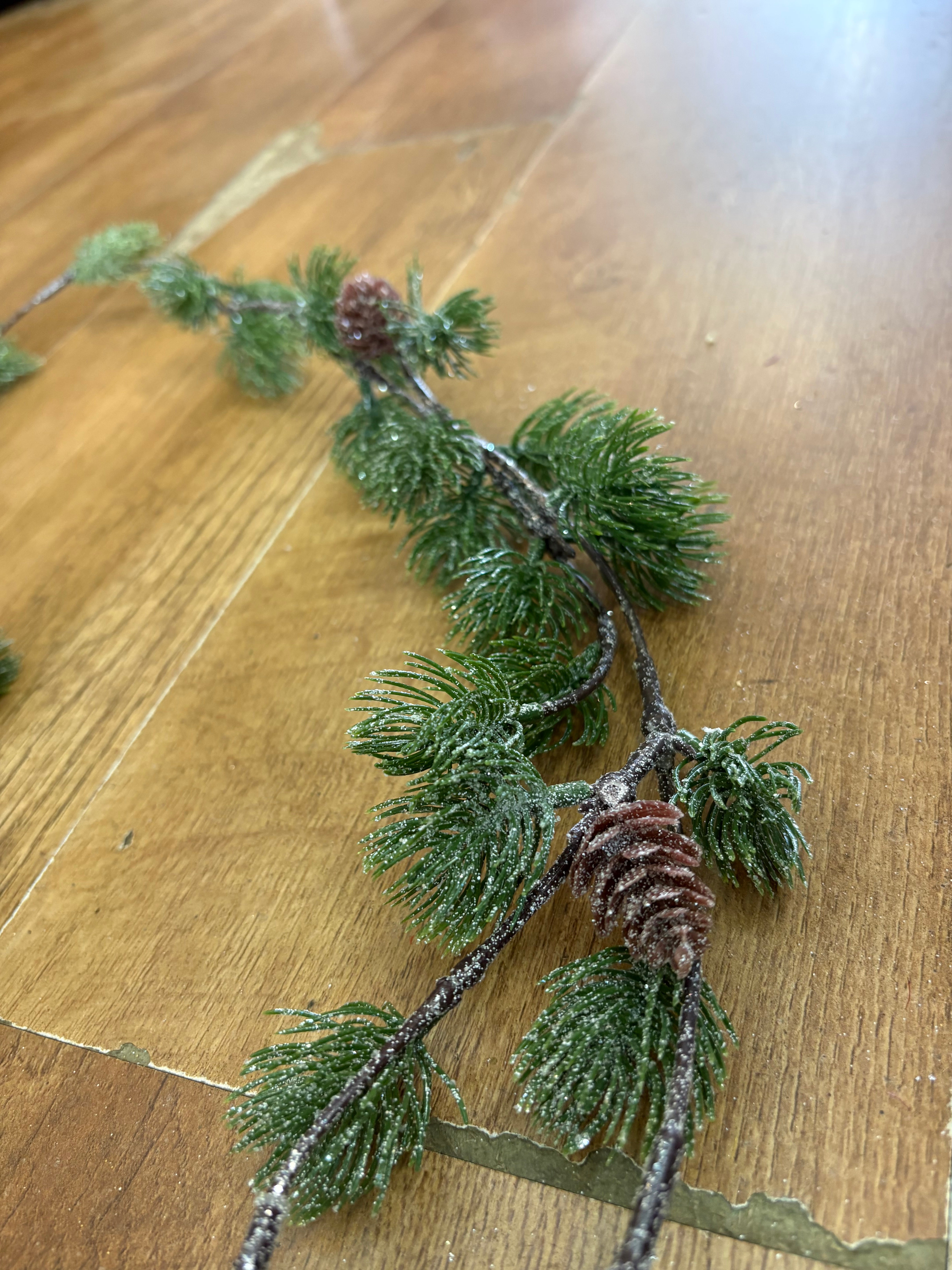 Glittered thistle greenery and miniature cone garland