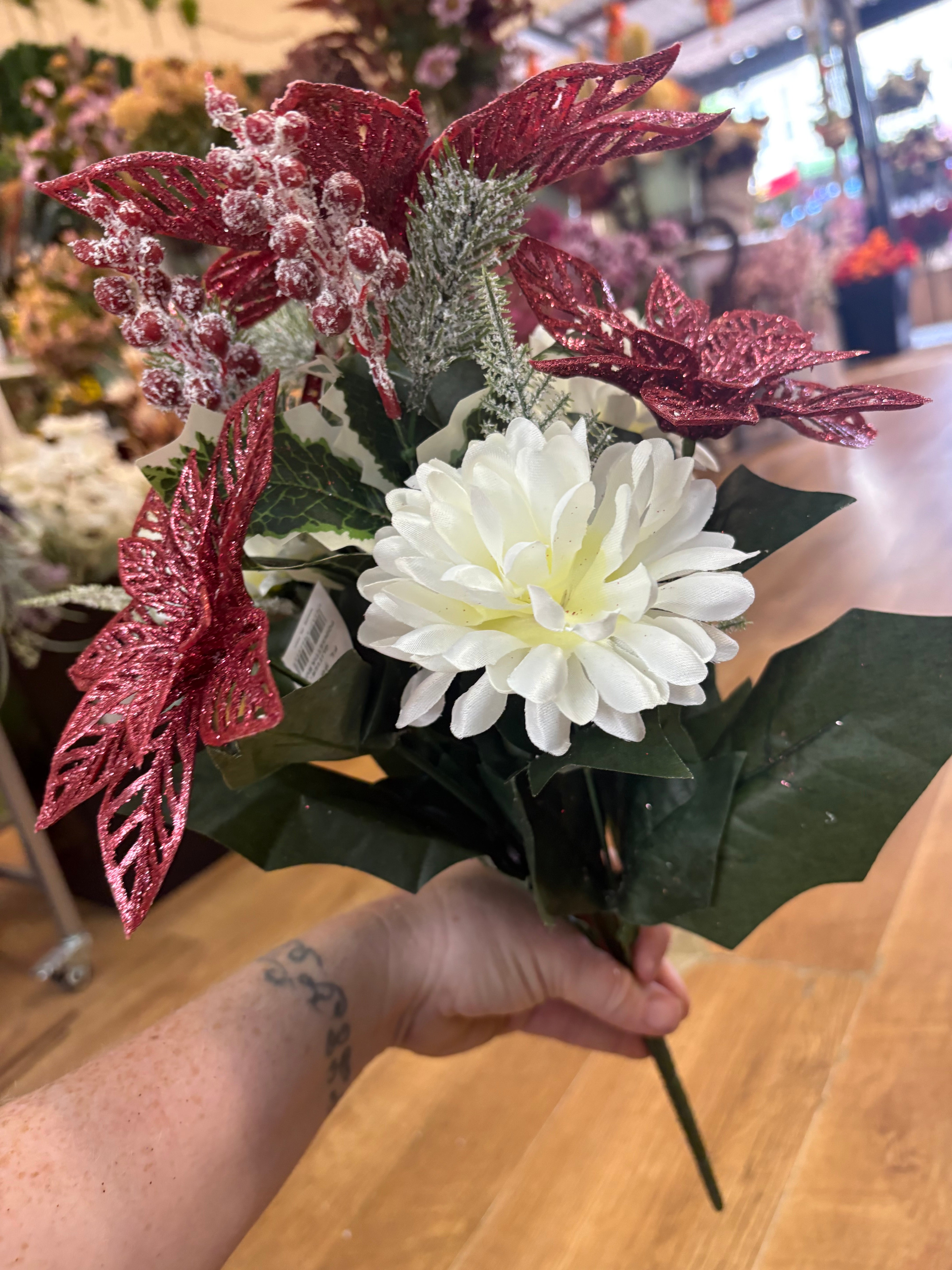 Pink glittered poinsettia and cream chrysanthemum bouquet