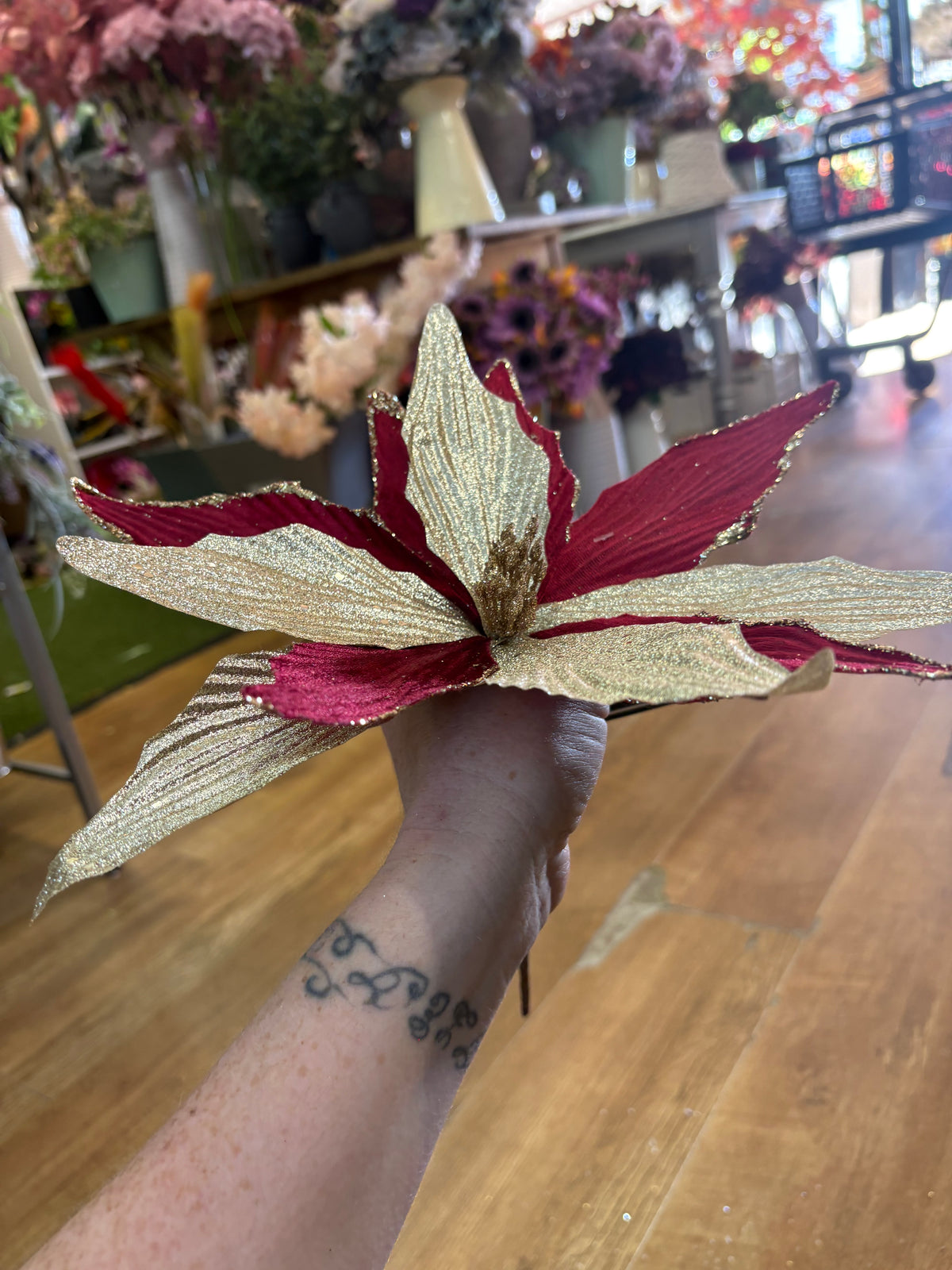 Burgundy velvet and metallic champagne poinsettia