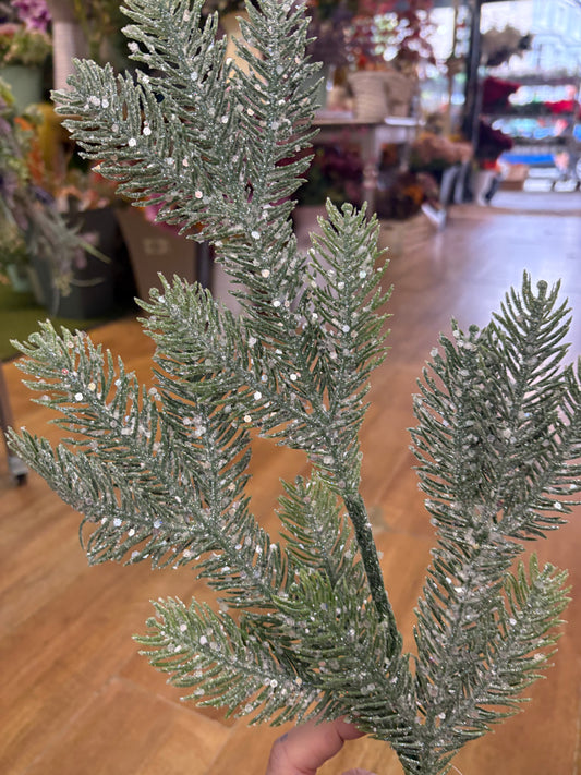 Long stem frosted and glittered winter foliage spray