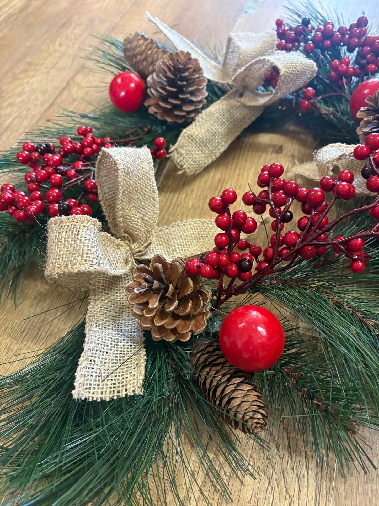 Red berry, cone and bow wreath (40cm from tip to tip)