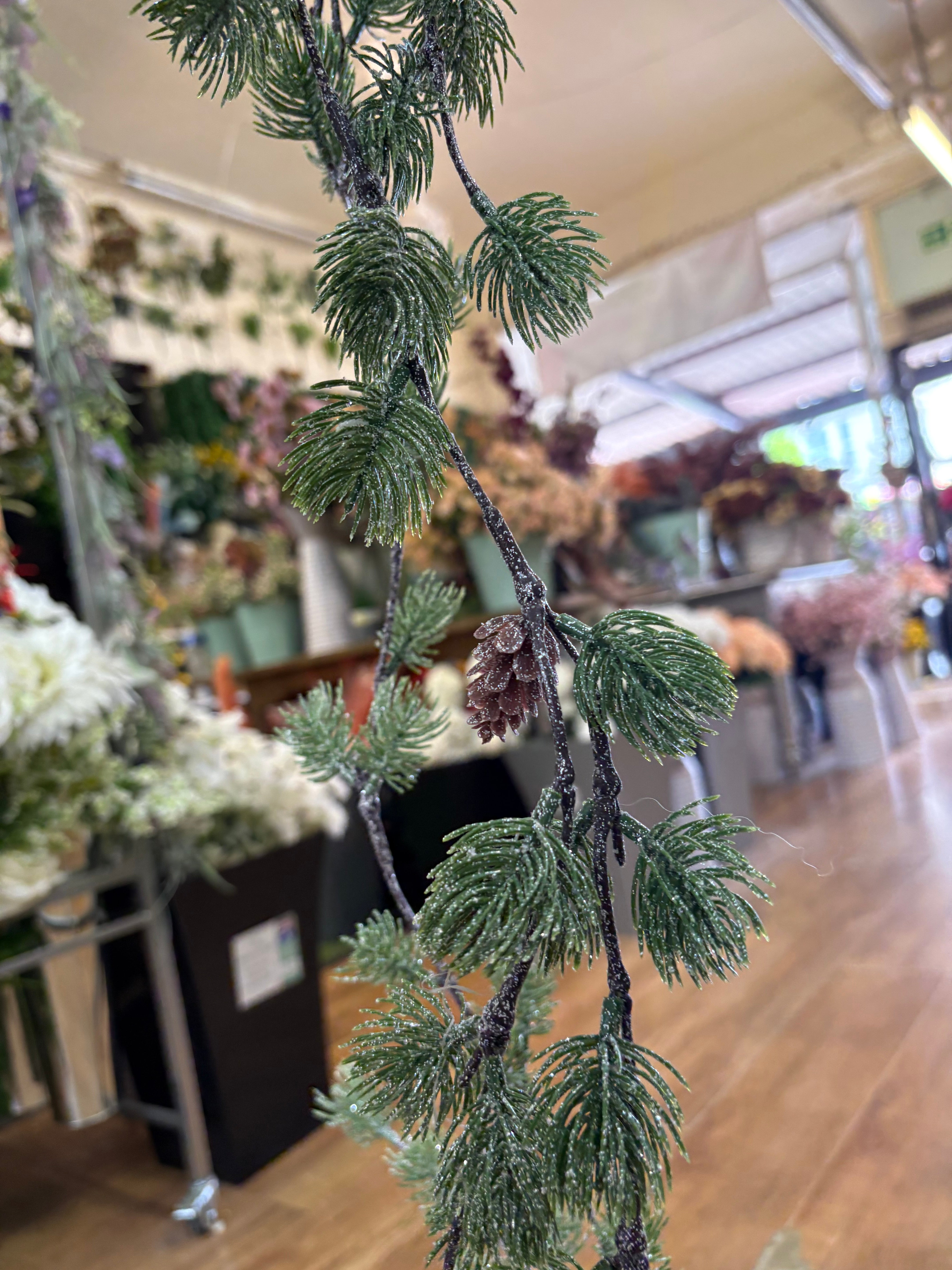 Glittered thistle greenery and miniature cone garland