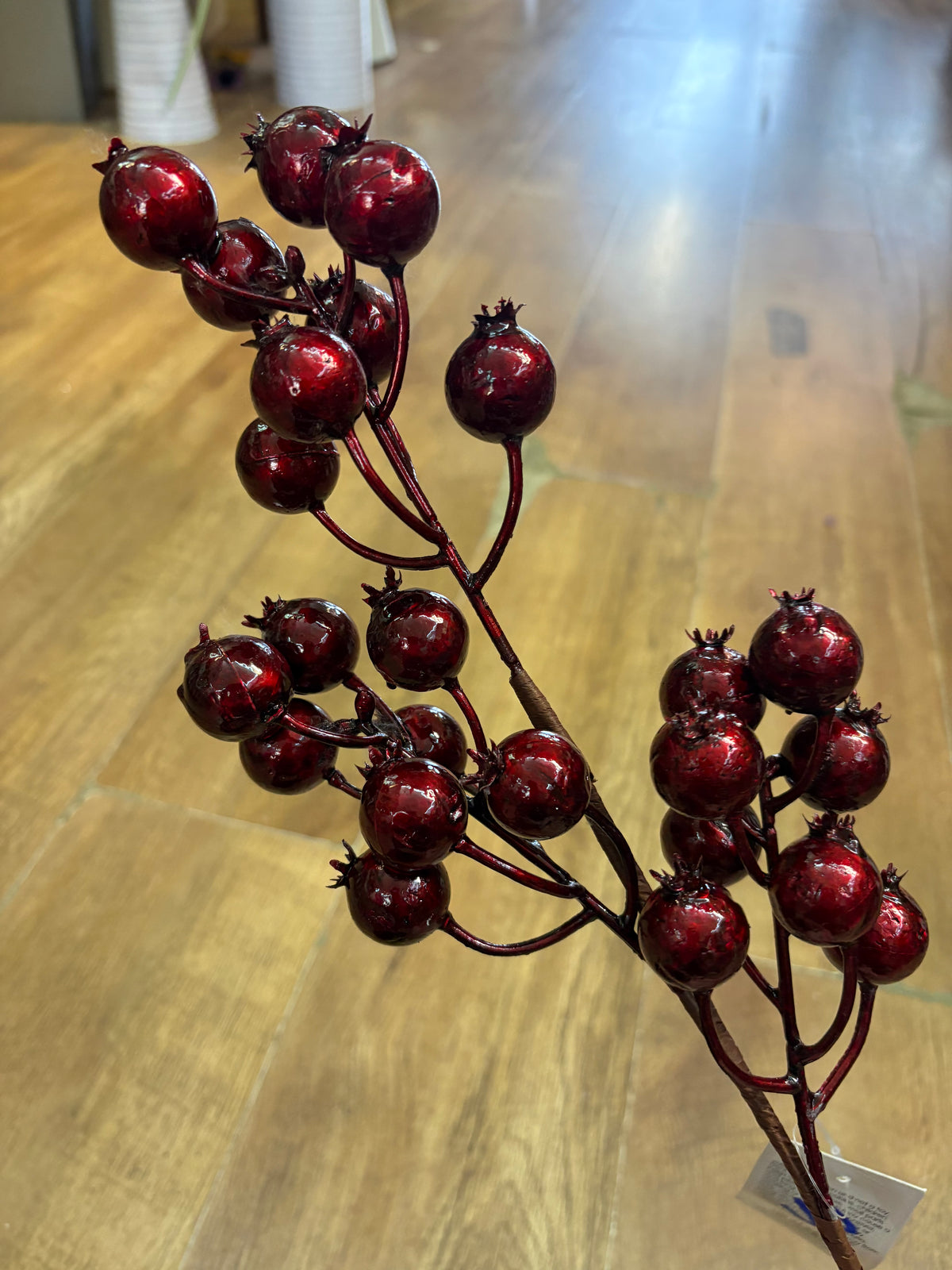 Long stem metallic burgundy rose hip spray