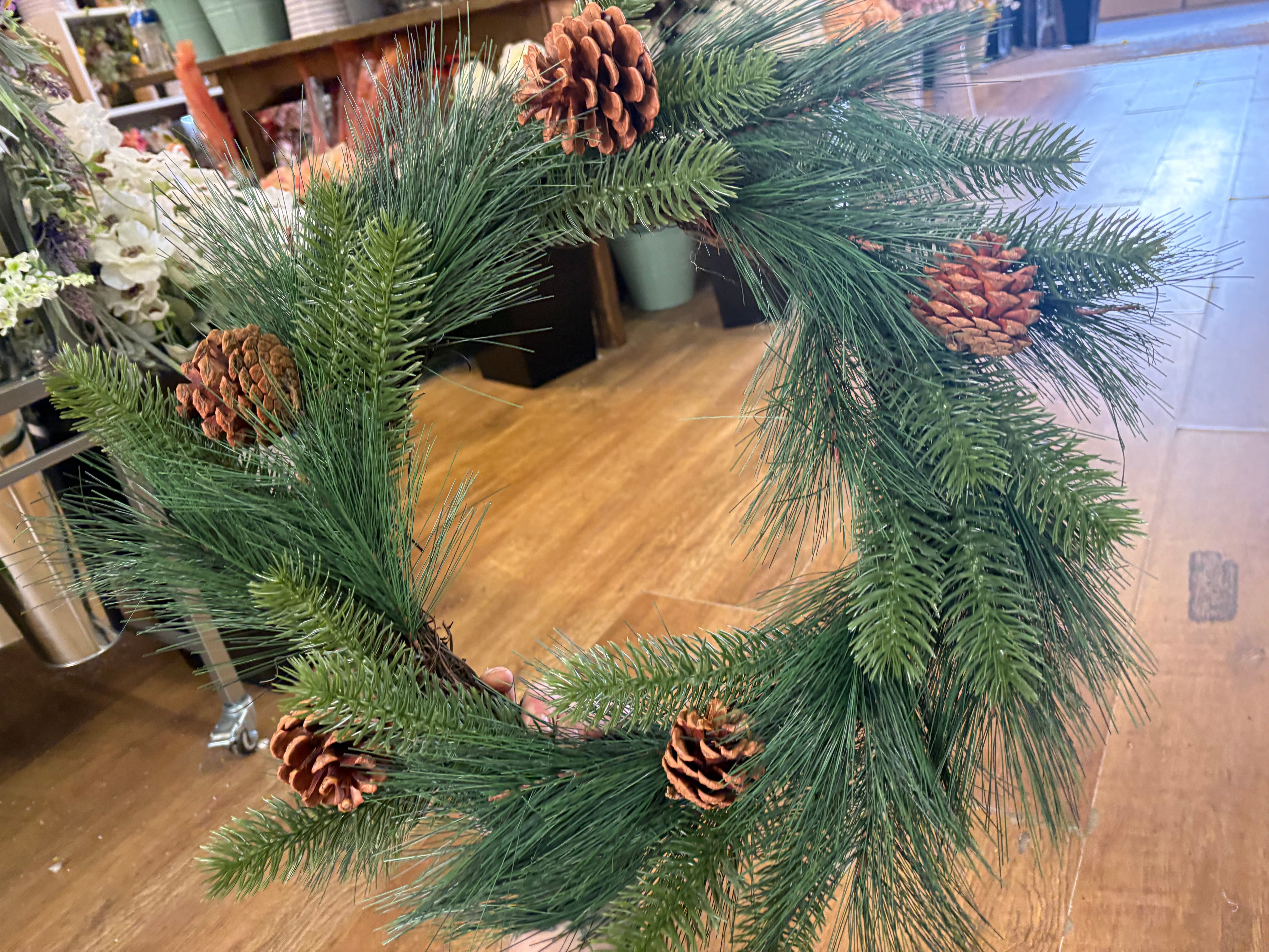 55cm mixed pine and spruce with cones wreath on grapevine base