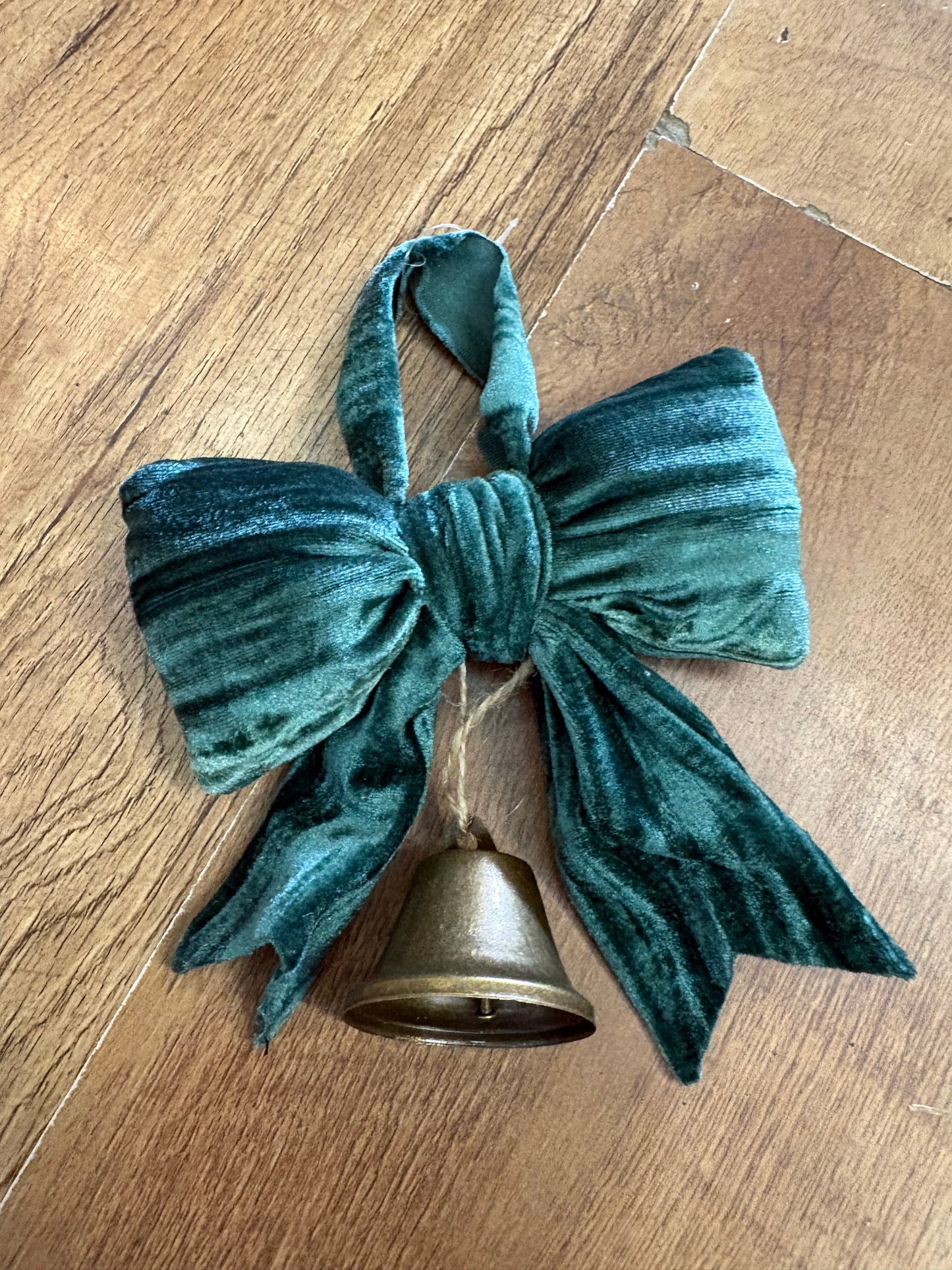 Small hanging green velvet bow and Christmas bell