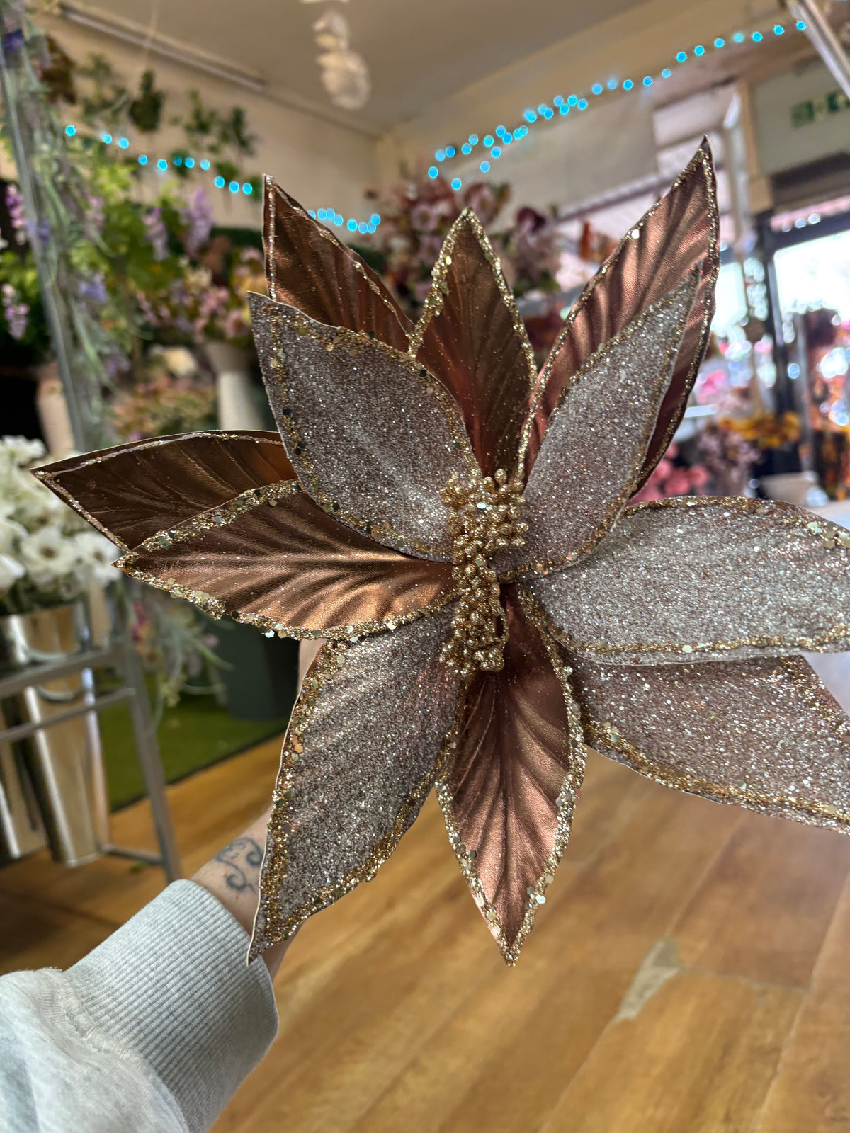 Large rose gold metallic and glittered single long stem poinsettia