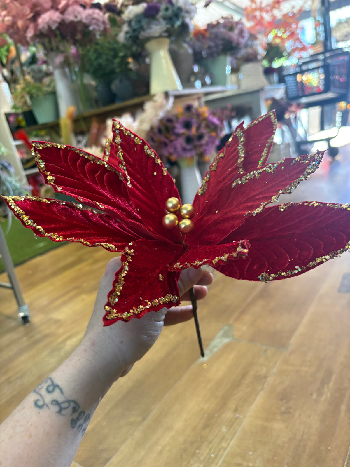 Red velvet and gold glittered poinsettia