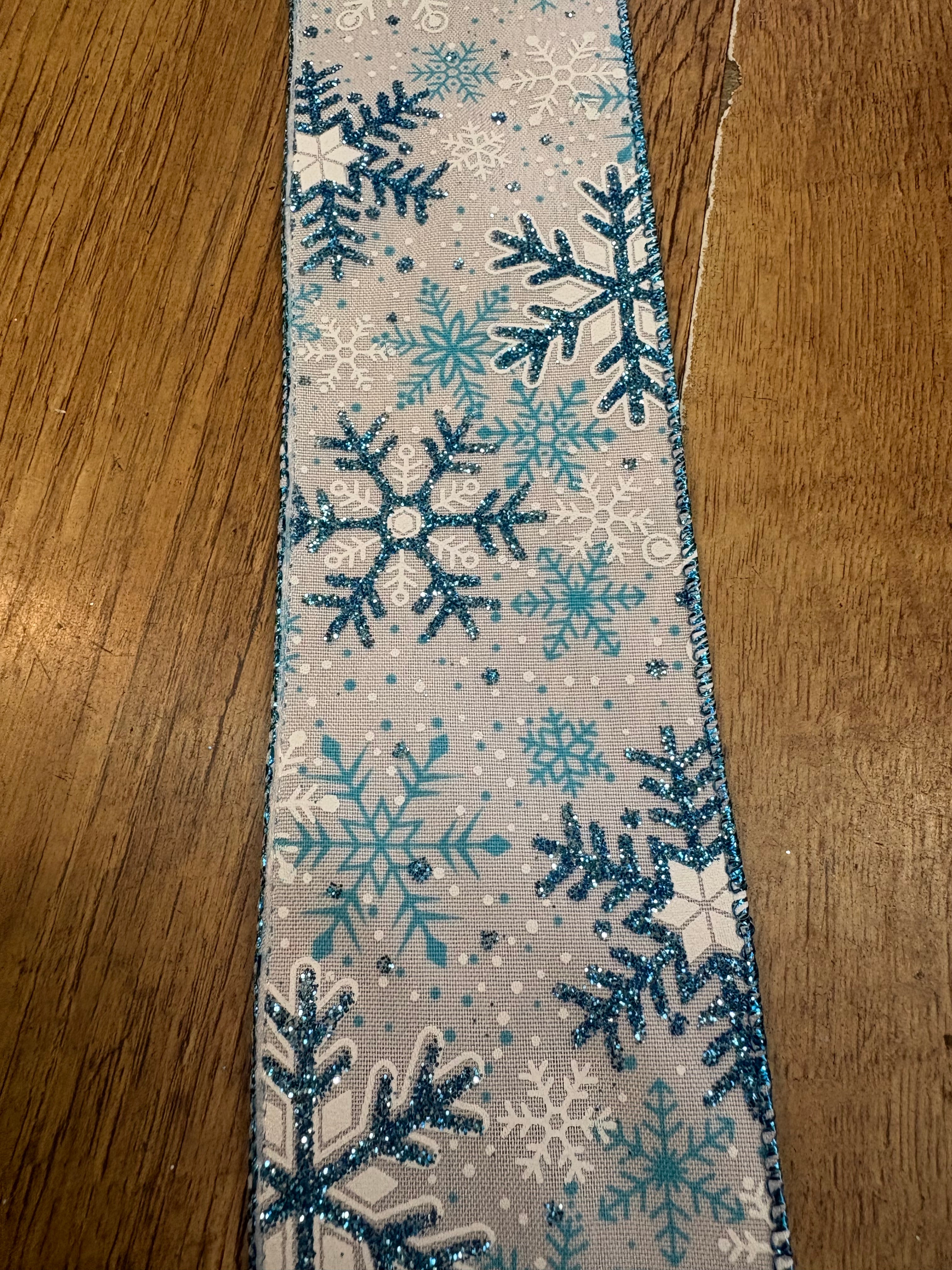 2.5 inch wide glittered blue and white snowflake wired ribbon - 10 metres