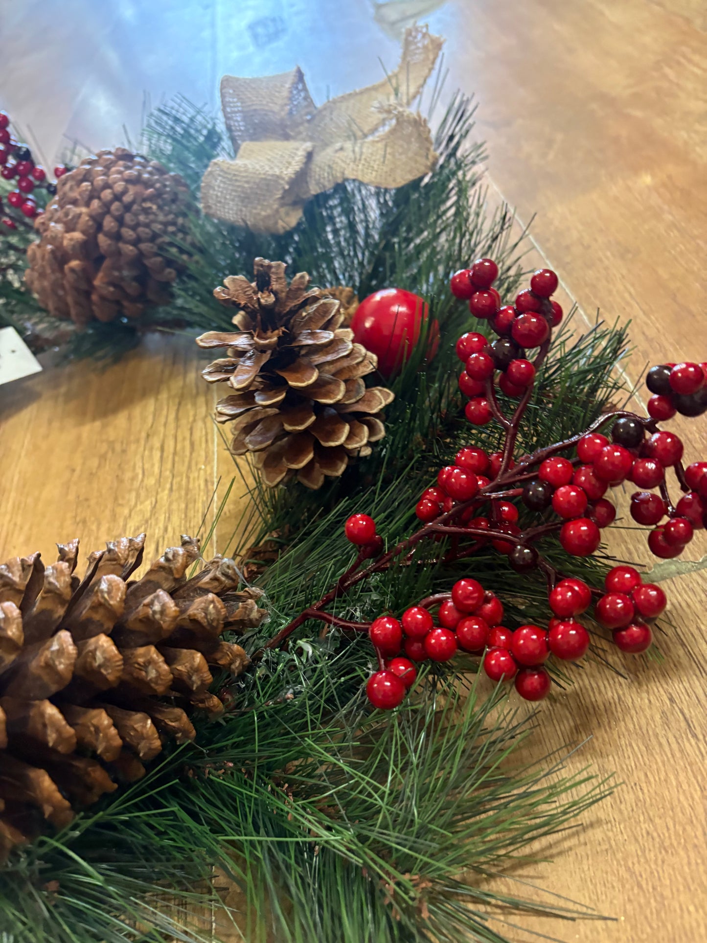 Red berry, cone and bow wreath (55cm from tip to tip)