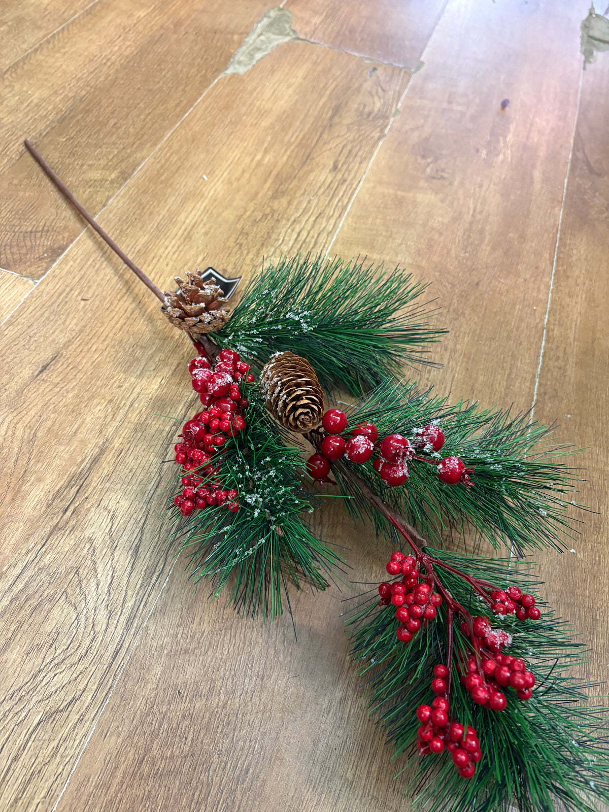 Long stem frosted foliage wi5 cones and mixed berries