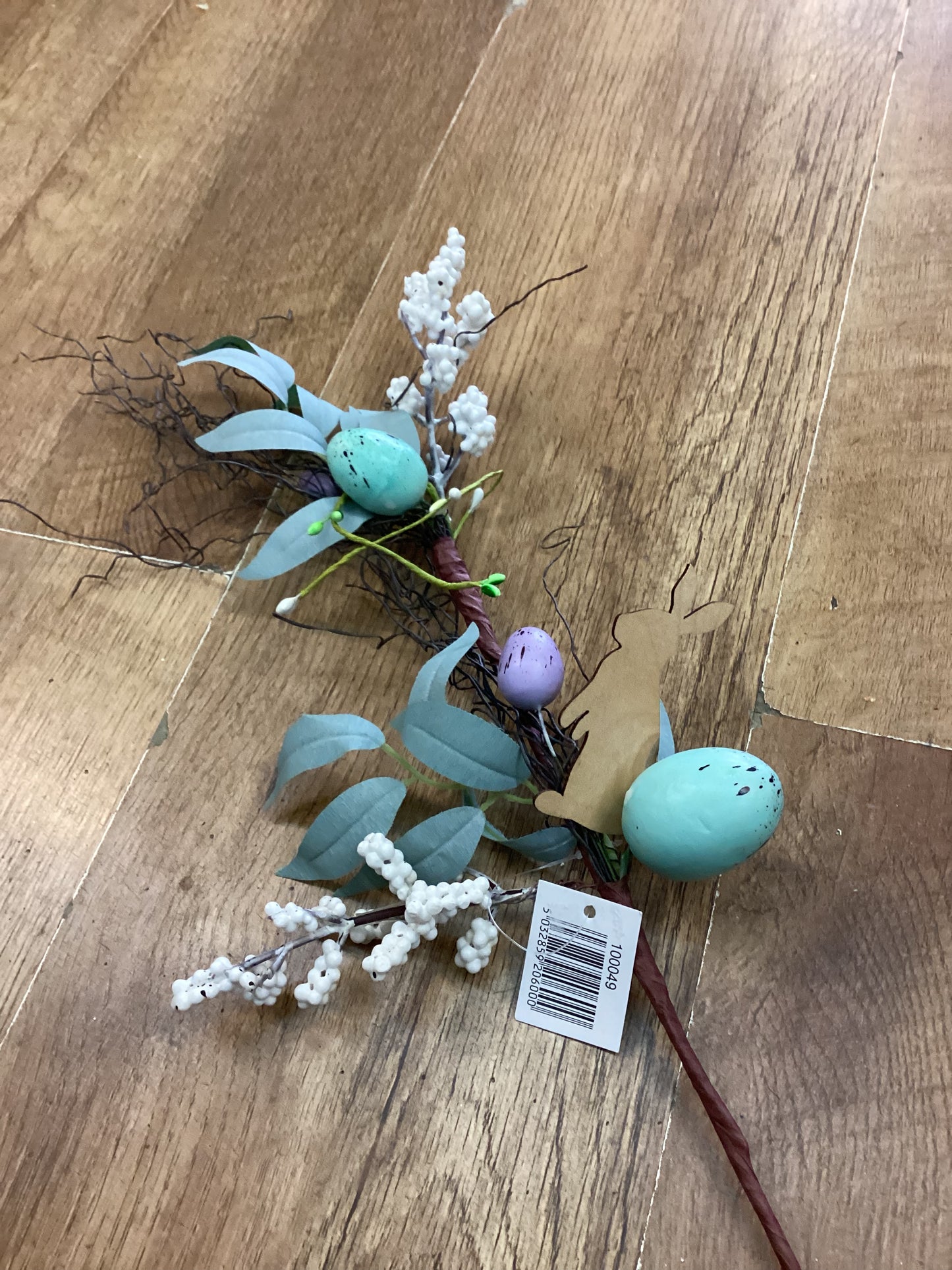 Wooden rabbit and Easter stem