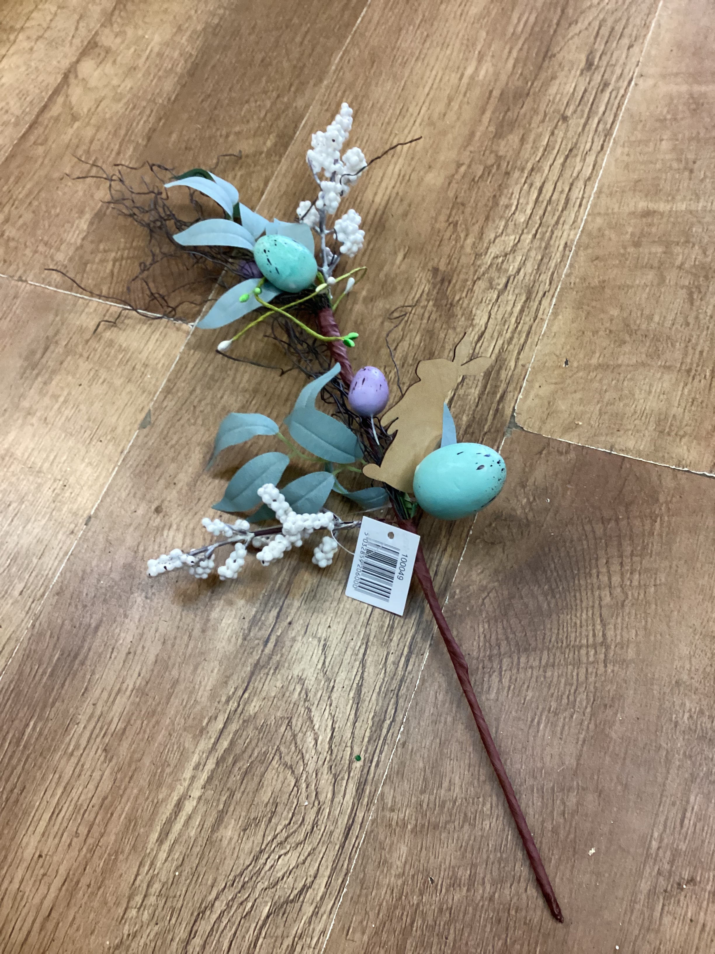 Wooden rabbit and Easter stem