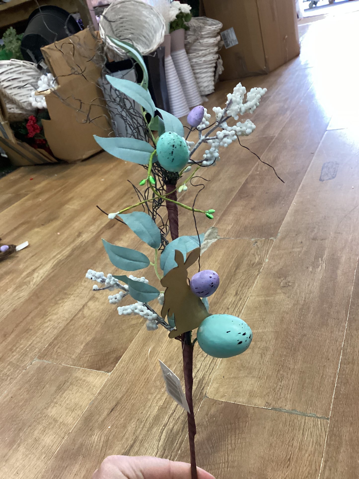 Wooden rabbit and Easter stem