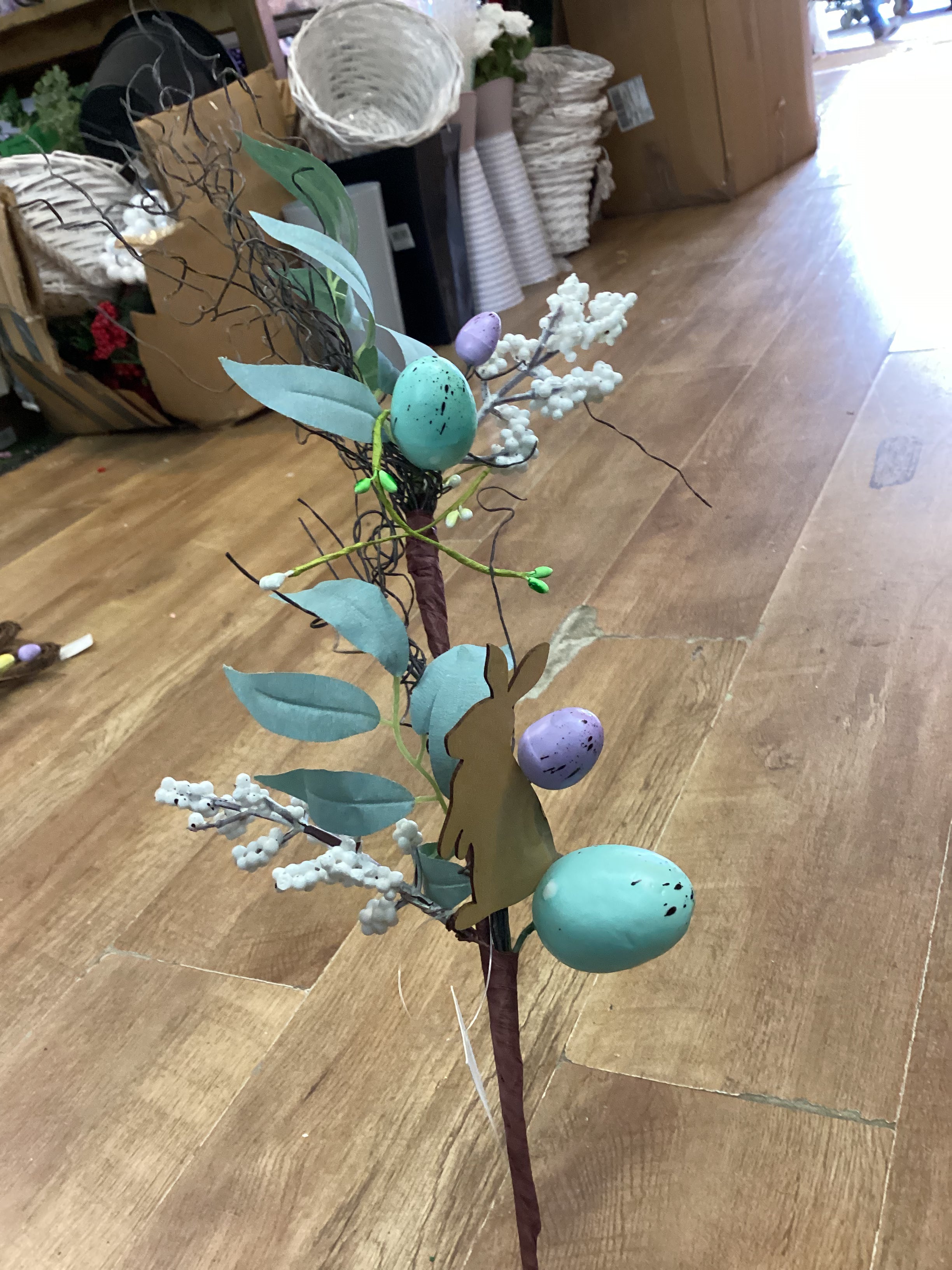Wooden rabbit and Easter stem