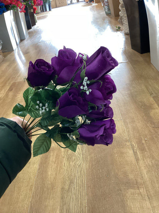 Big bunch of purple rose with gypsophila