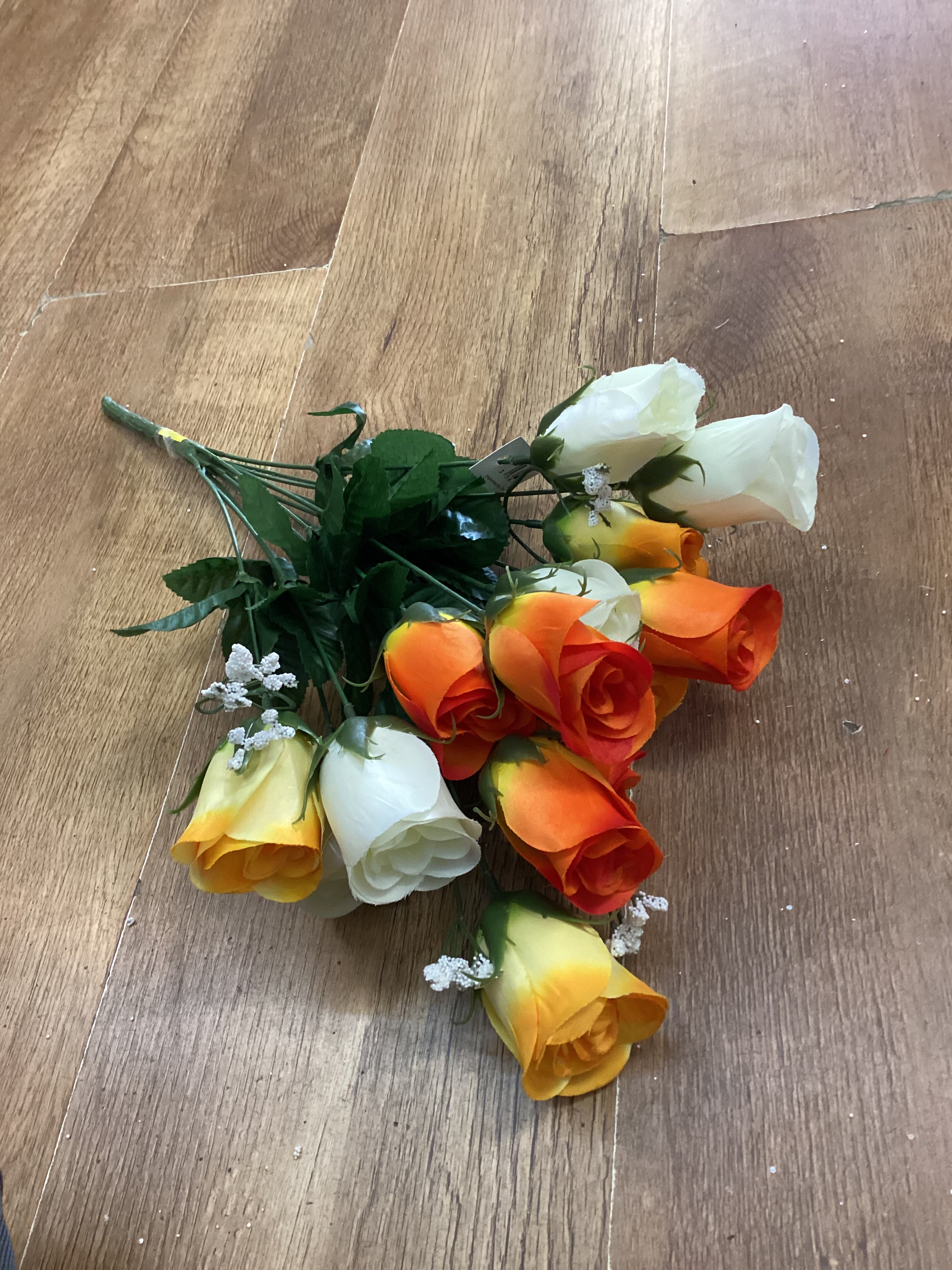 Big bunch of orange, yellow and ivory roses and gypsophila