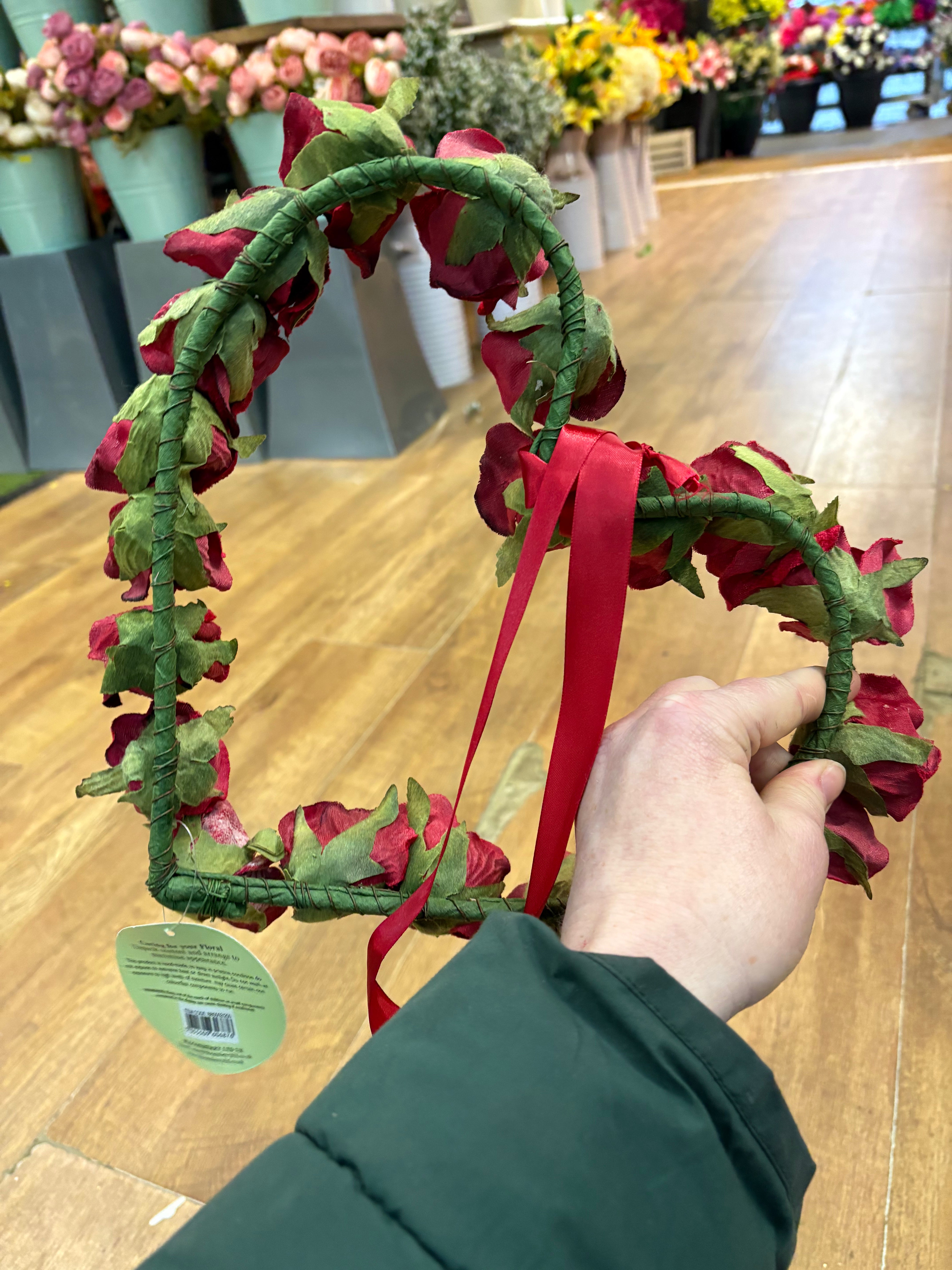 Red velvet rose heart wreath with hanging red ribbon
