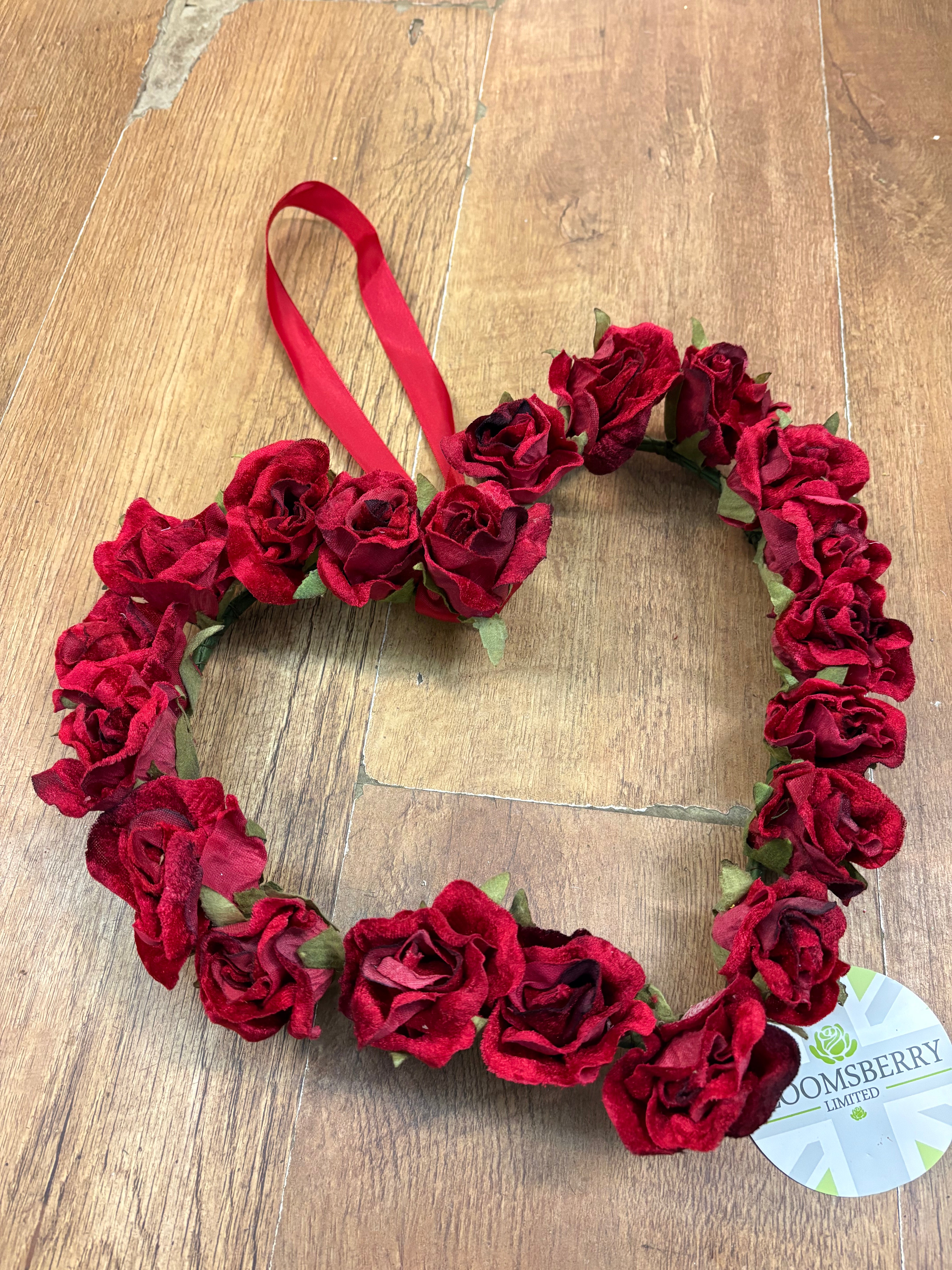 Red velvet rose heart wreath with hanging red ribbon
