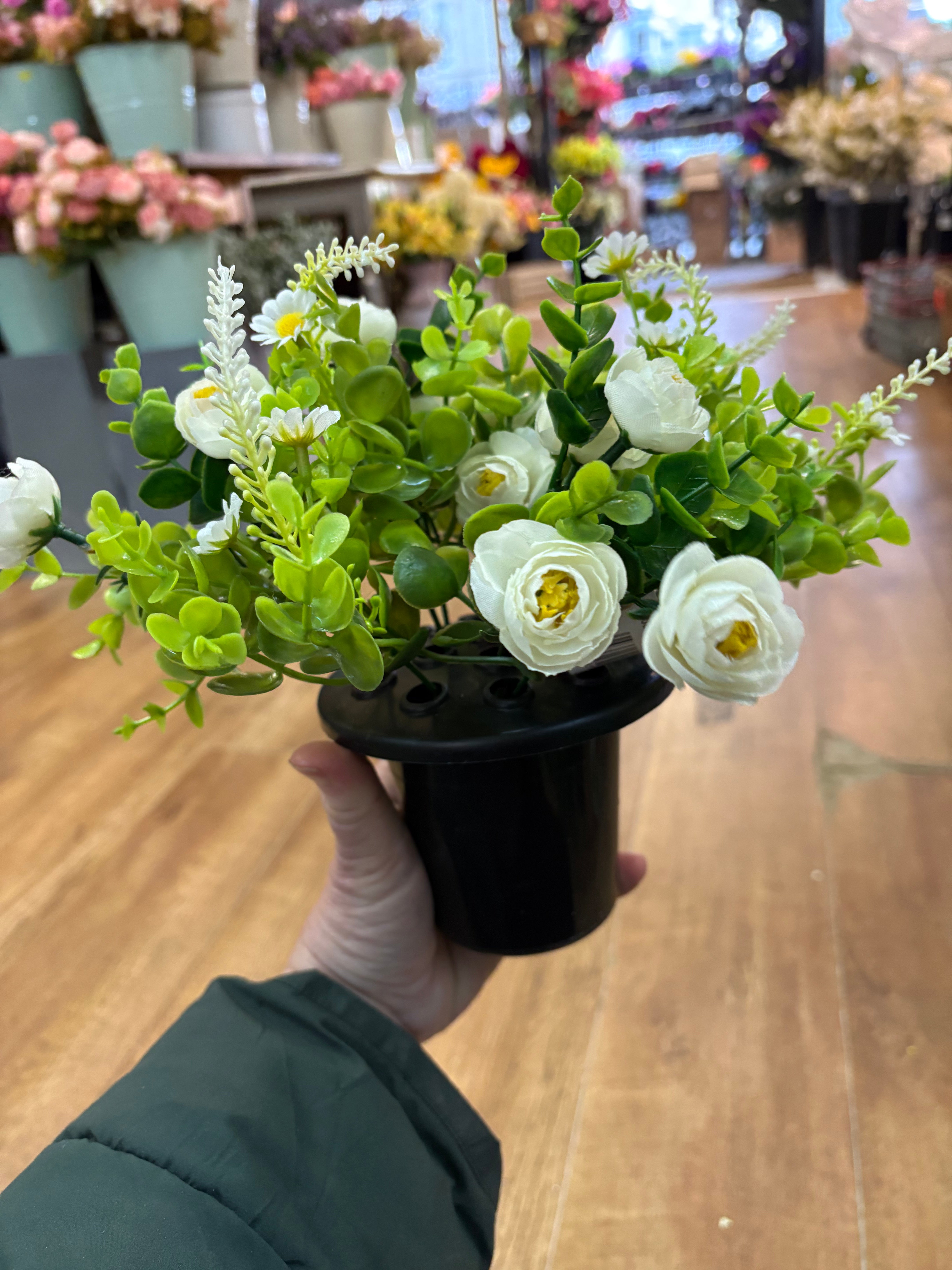 Ivory mini ranunculus and eucalyptus gravepot