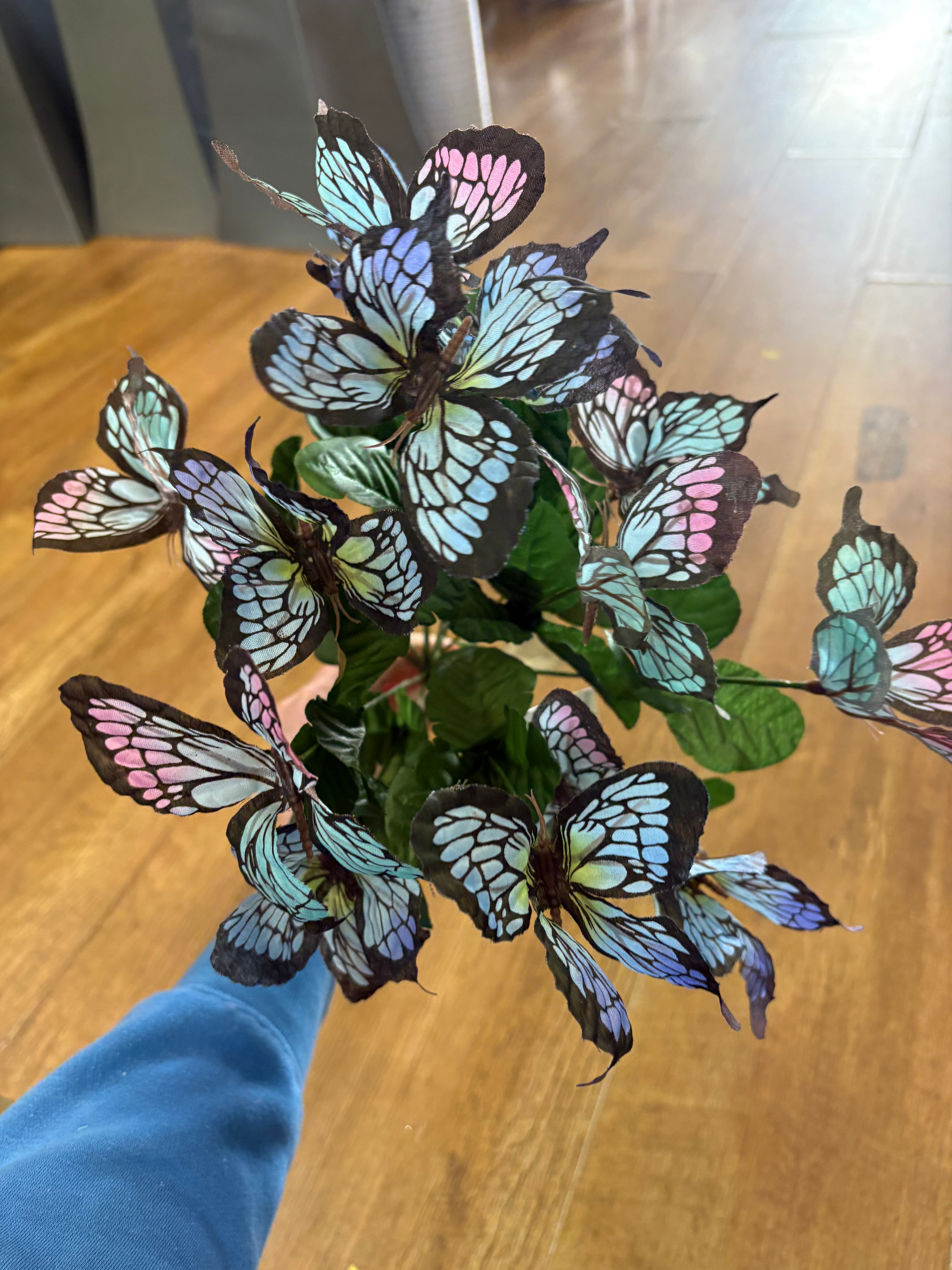 Big bunch of pale blue and pink butterflies