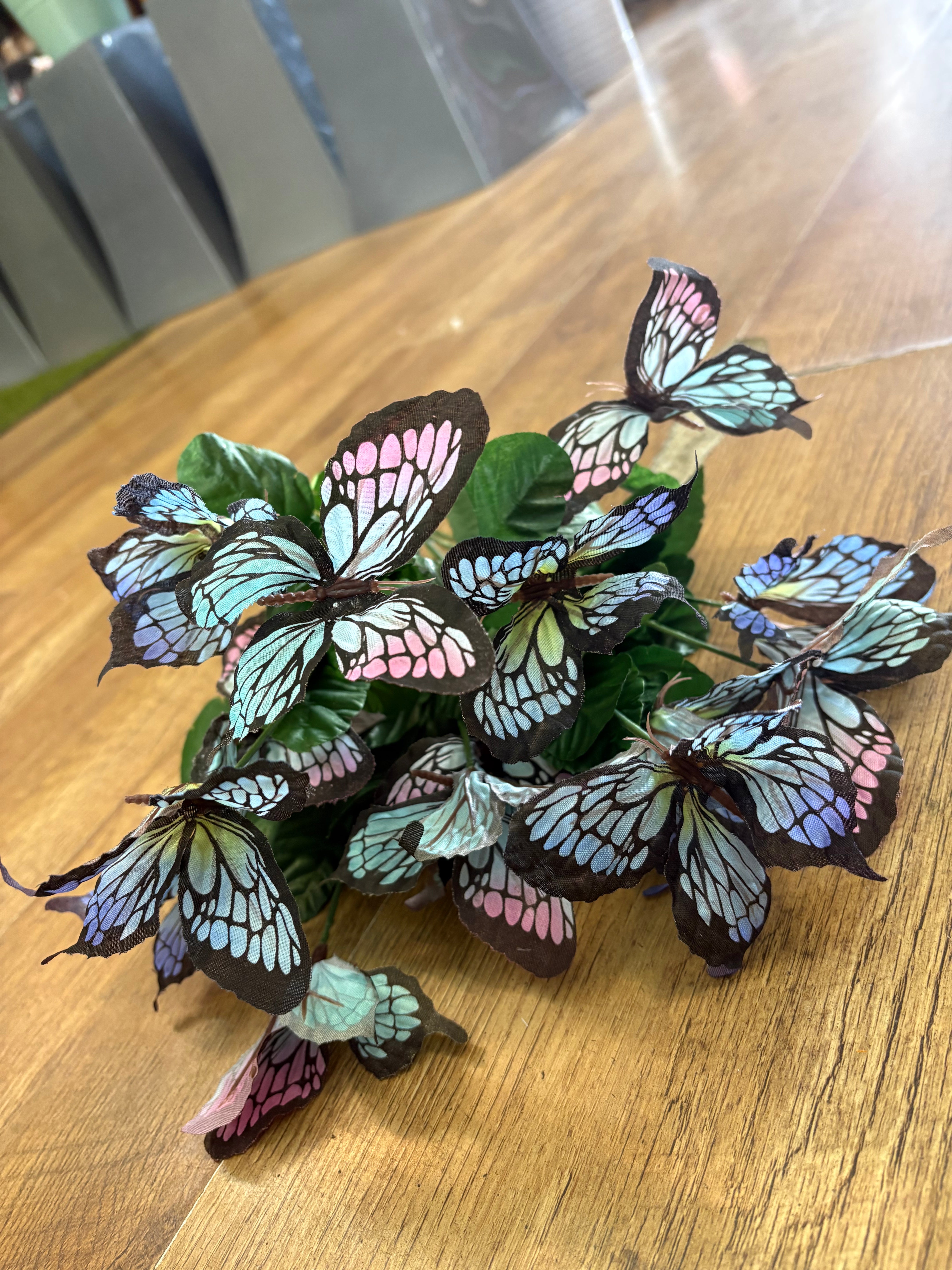 Big bunch of pale blue and pink butterflies