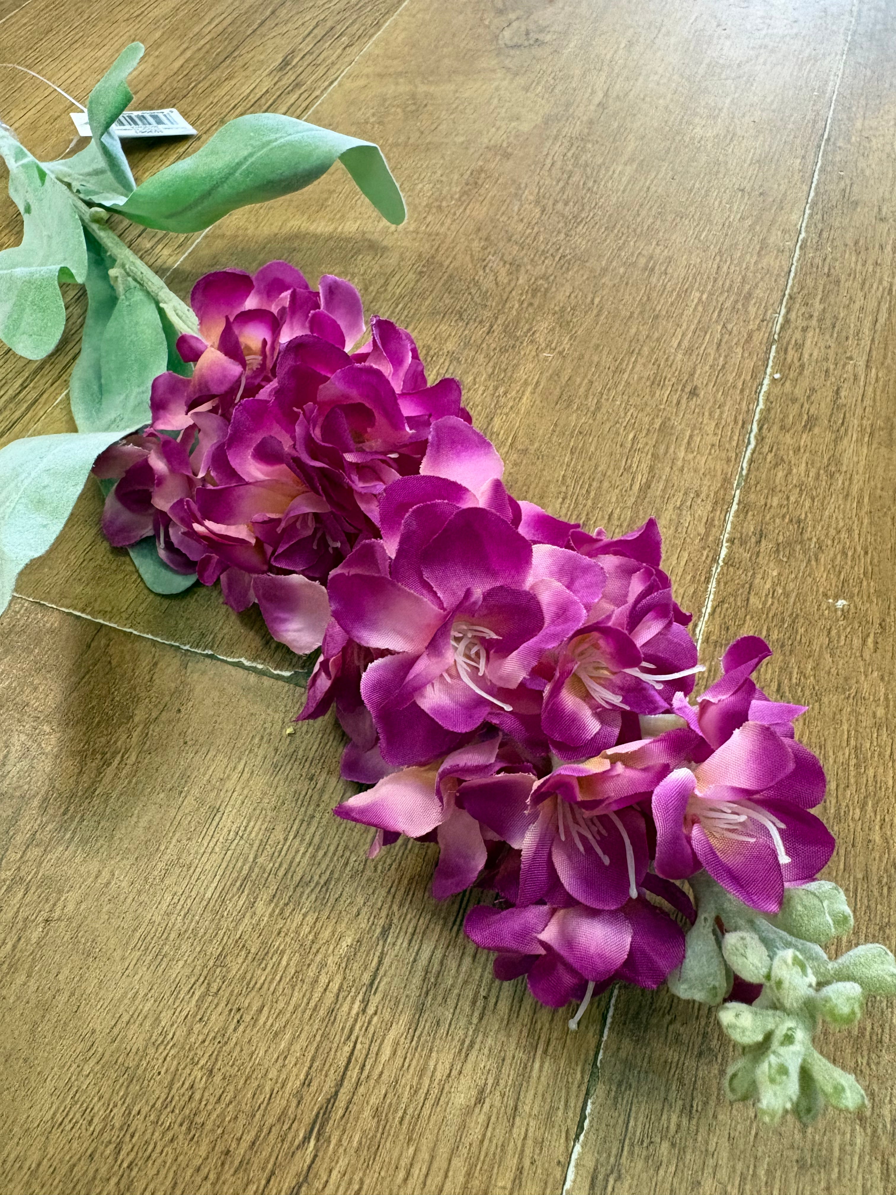 Single stem magenta stock flower
