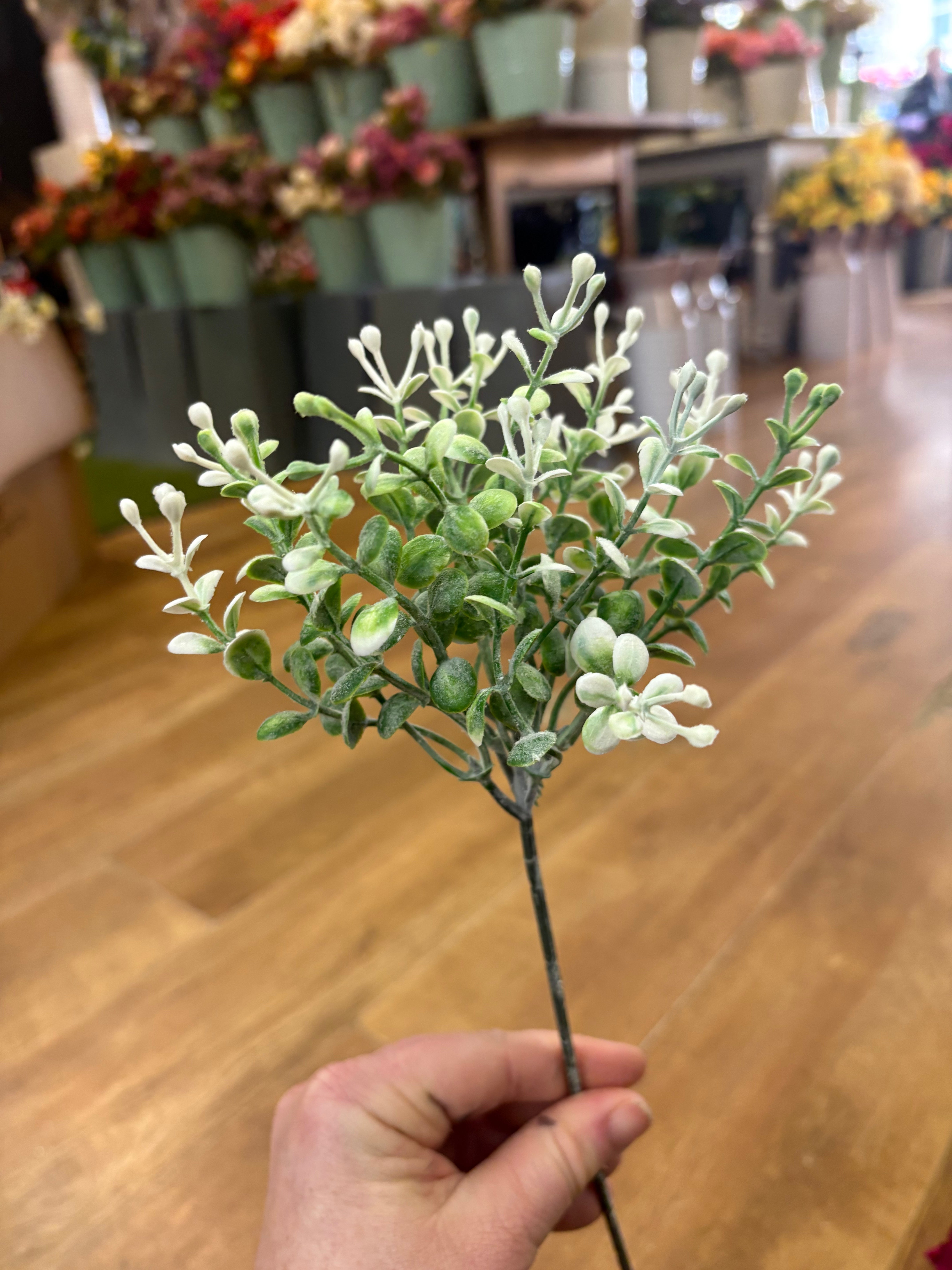 Flocked white dotty sprig pick