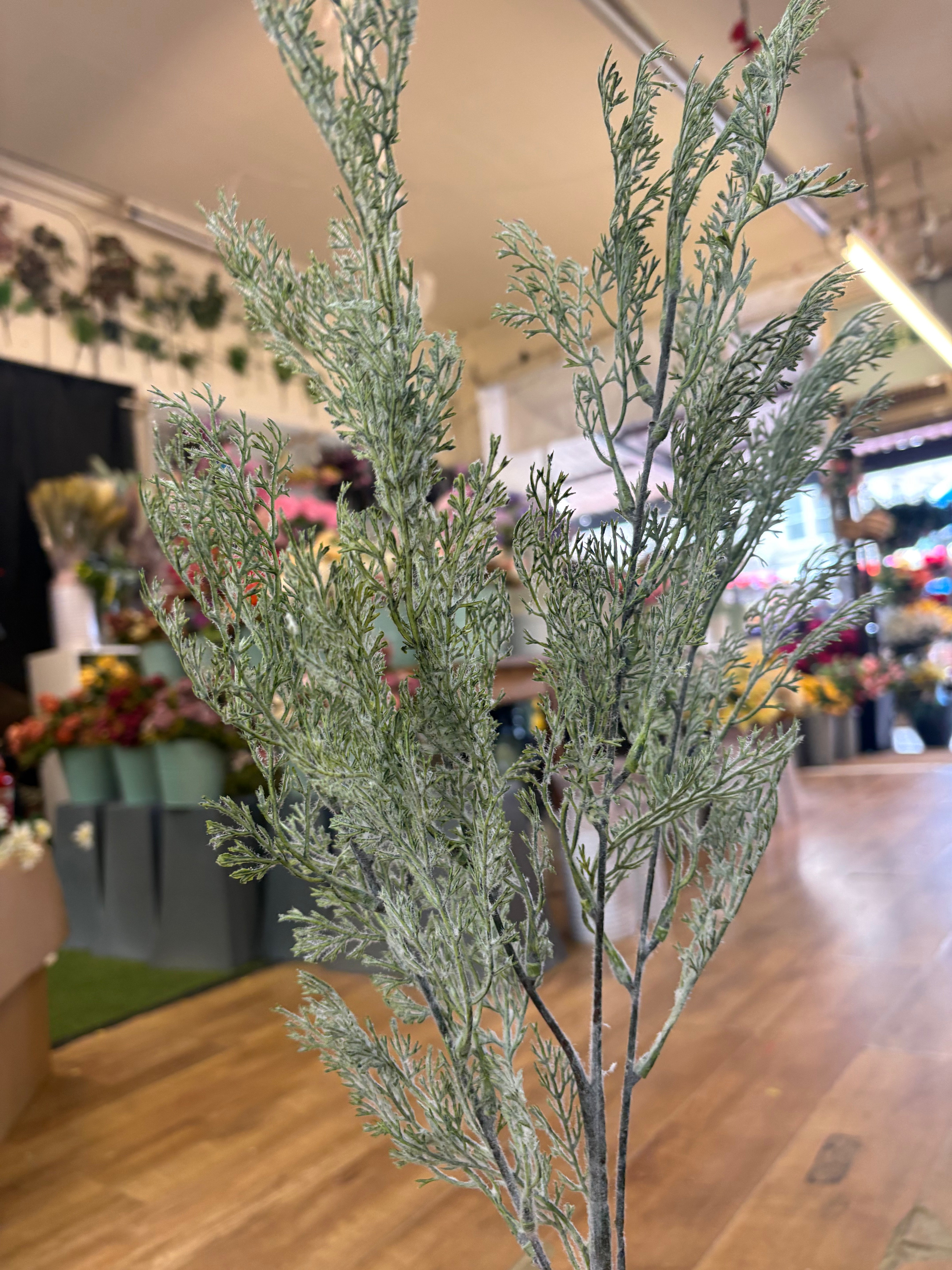 Long stem green whimsical conifer spray