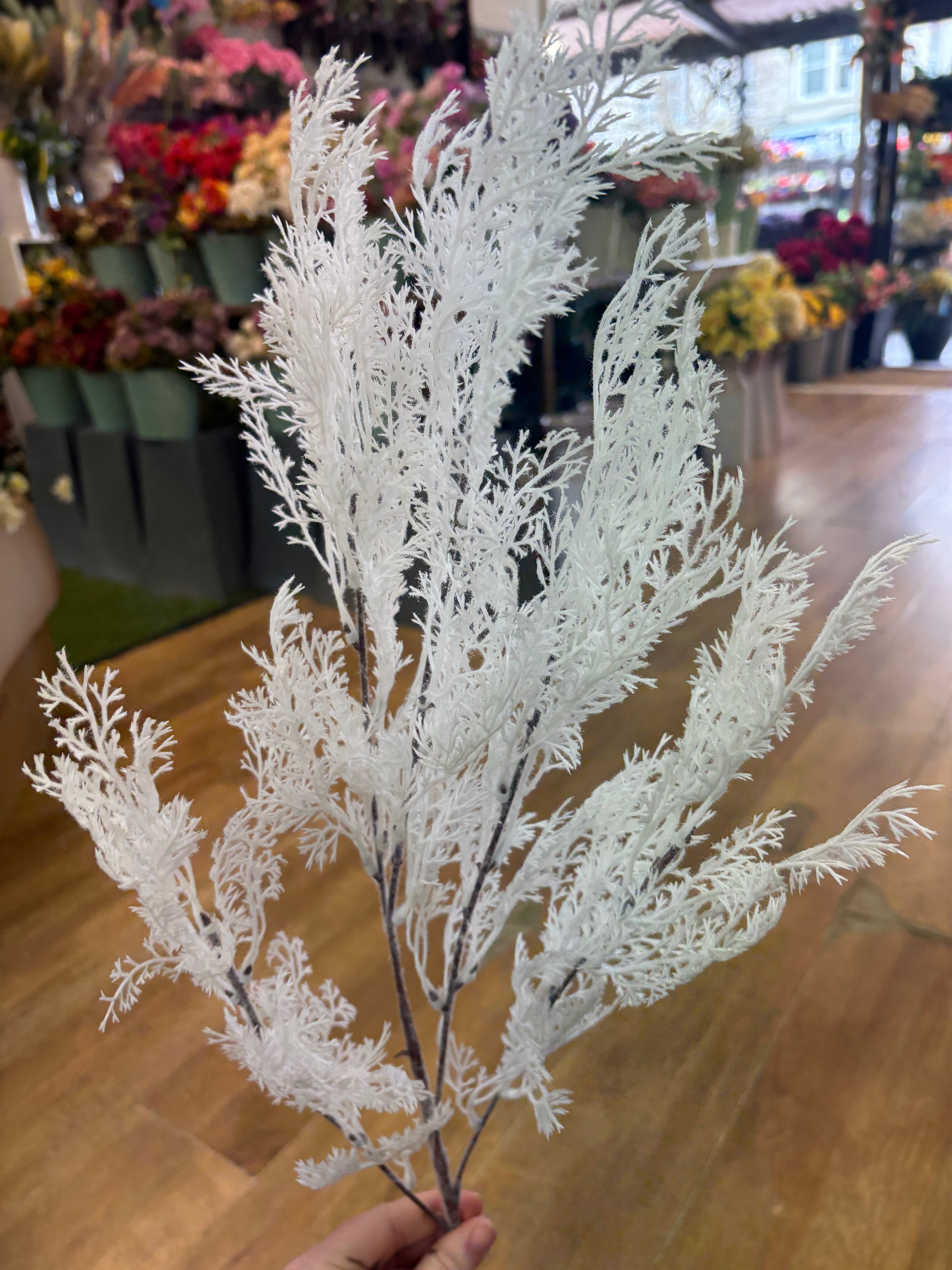 Long stem white whimsical conifer spray