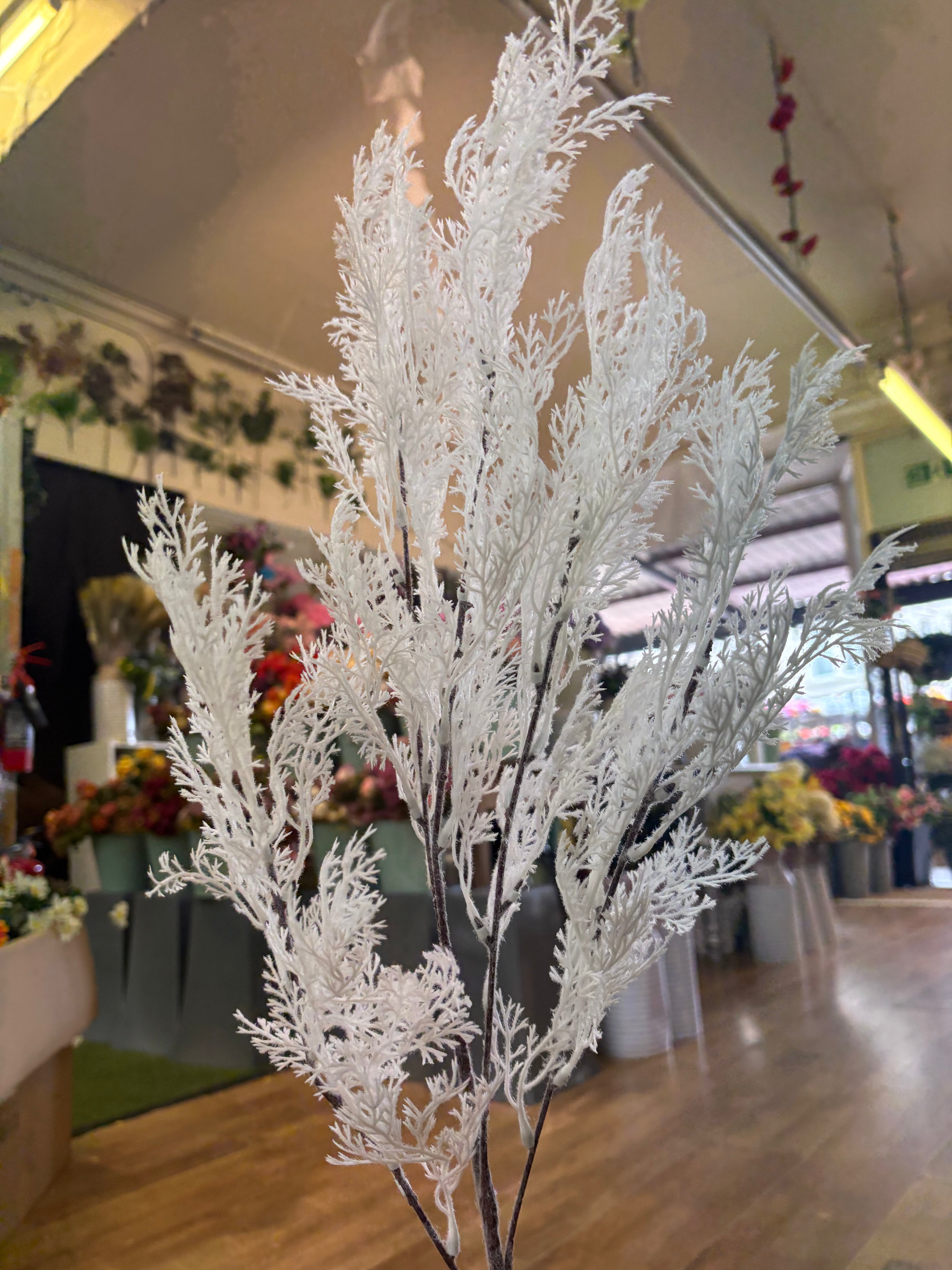 Long stem white whimsical conifer spray