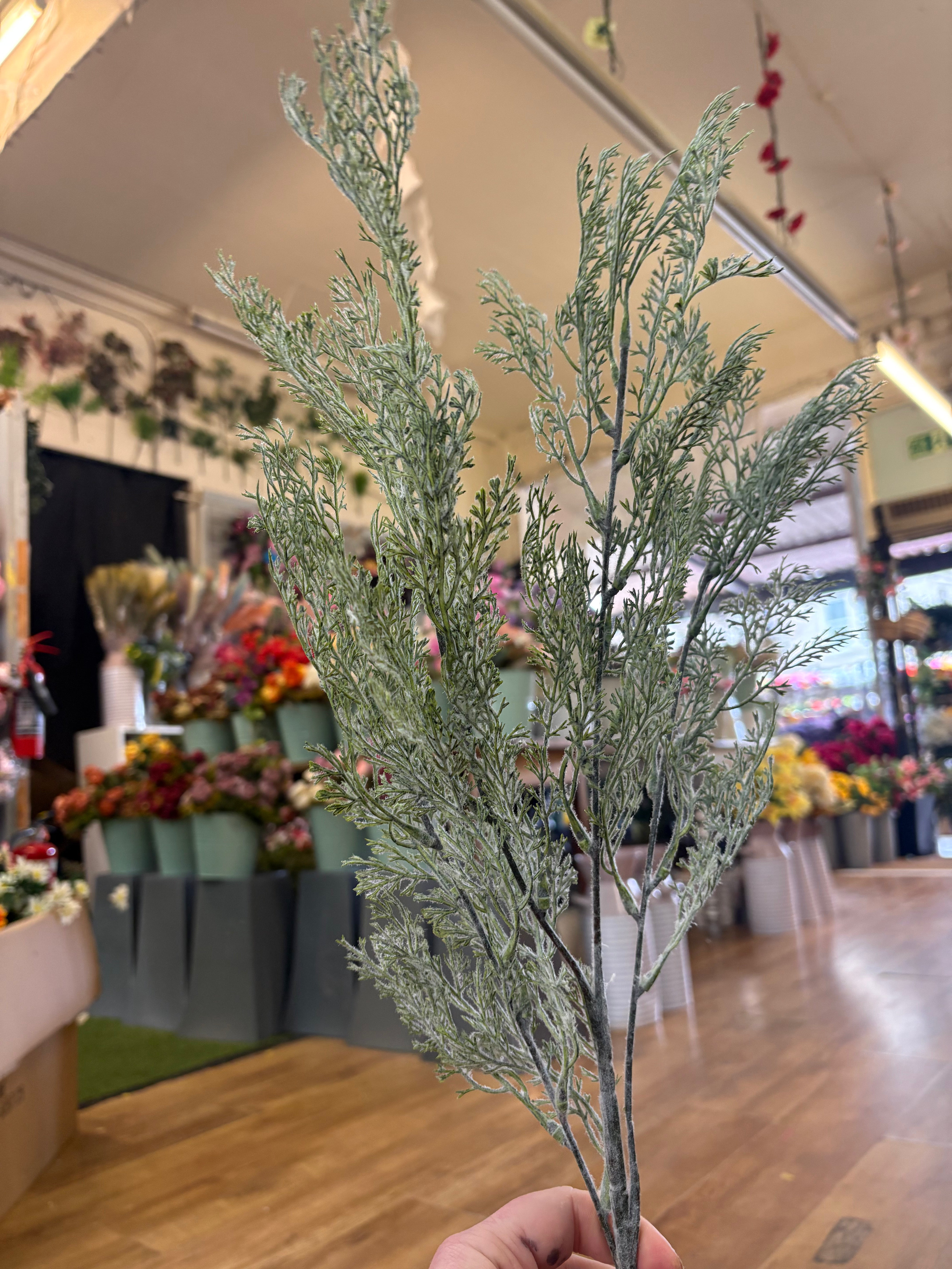 Long stem green whimsical conifer spray