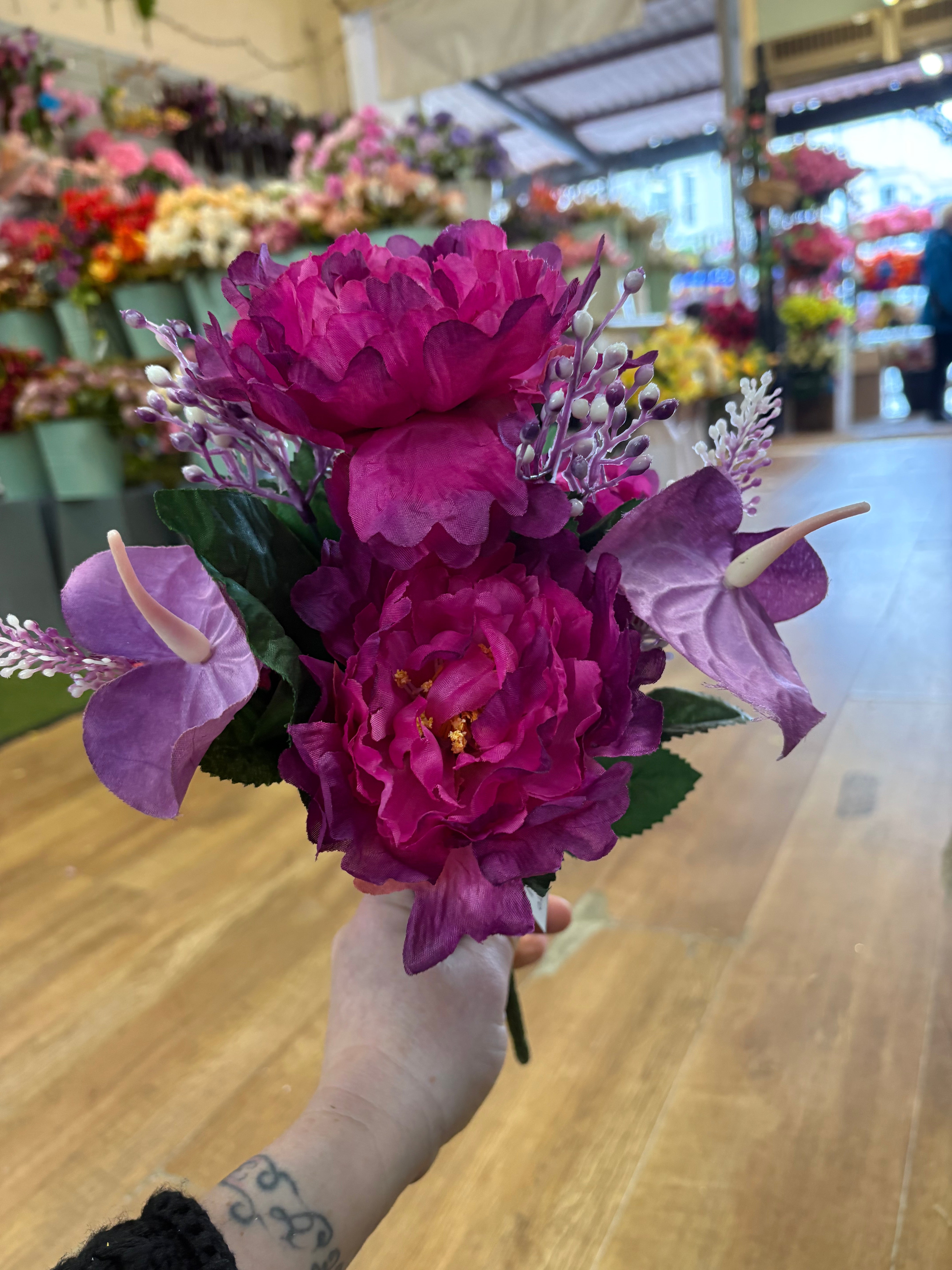 Magenta and purple frilly peony and anthurium bouquet