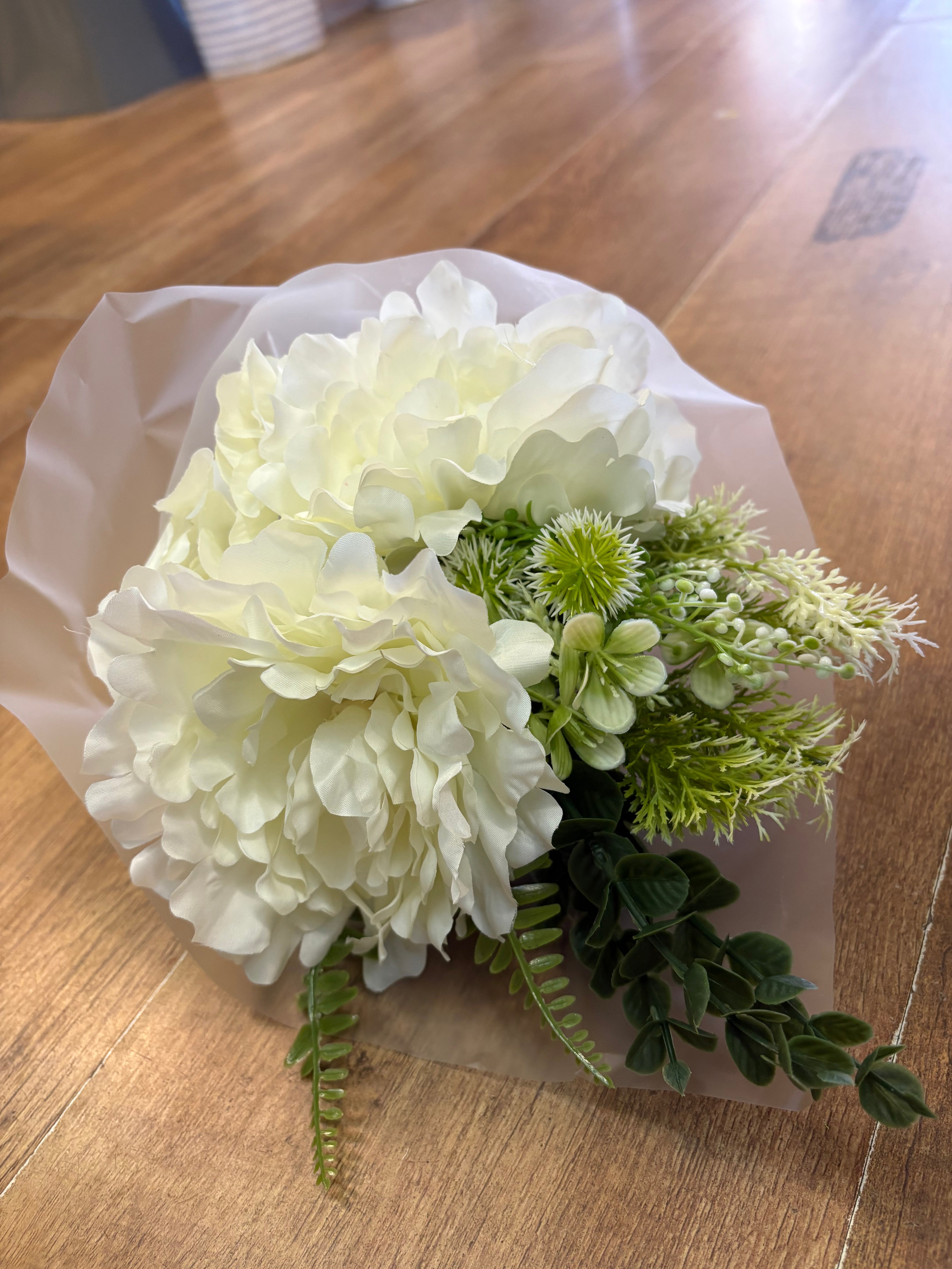 Small wrapped ivory peony and mixed foliage bouquet