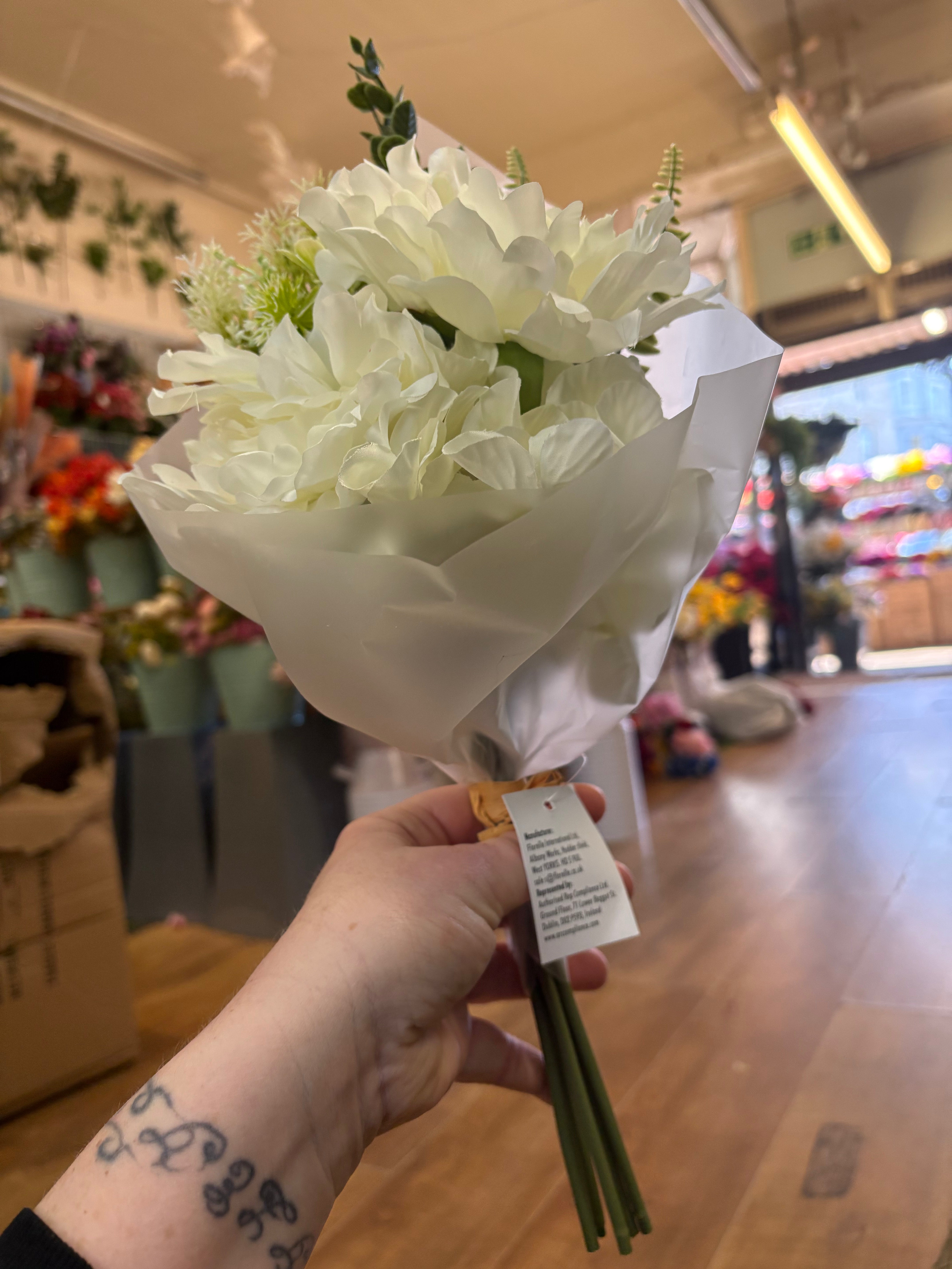 Small wrapped ivory peony and mixed foliage bouquet