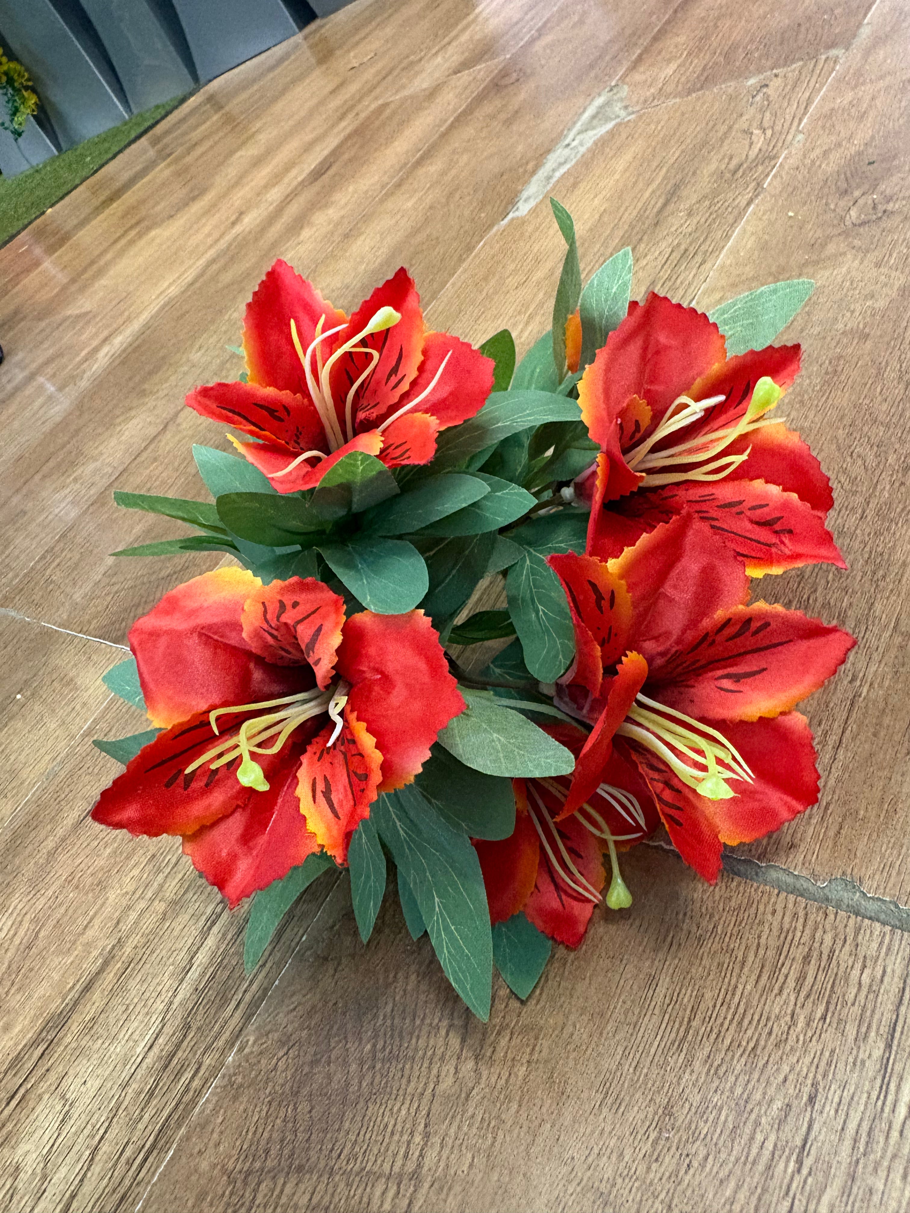 Orange tiger lily and foliage bush