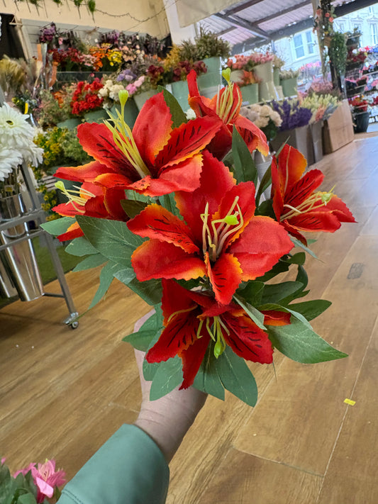 Orange tiger lily and foliage bush