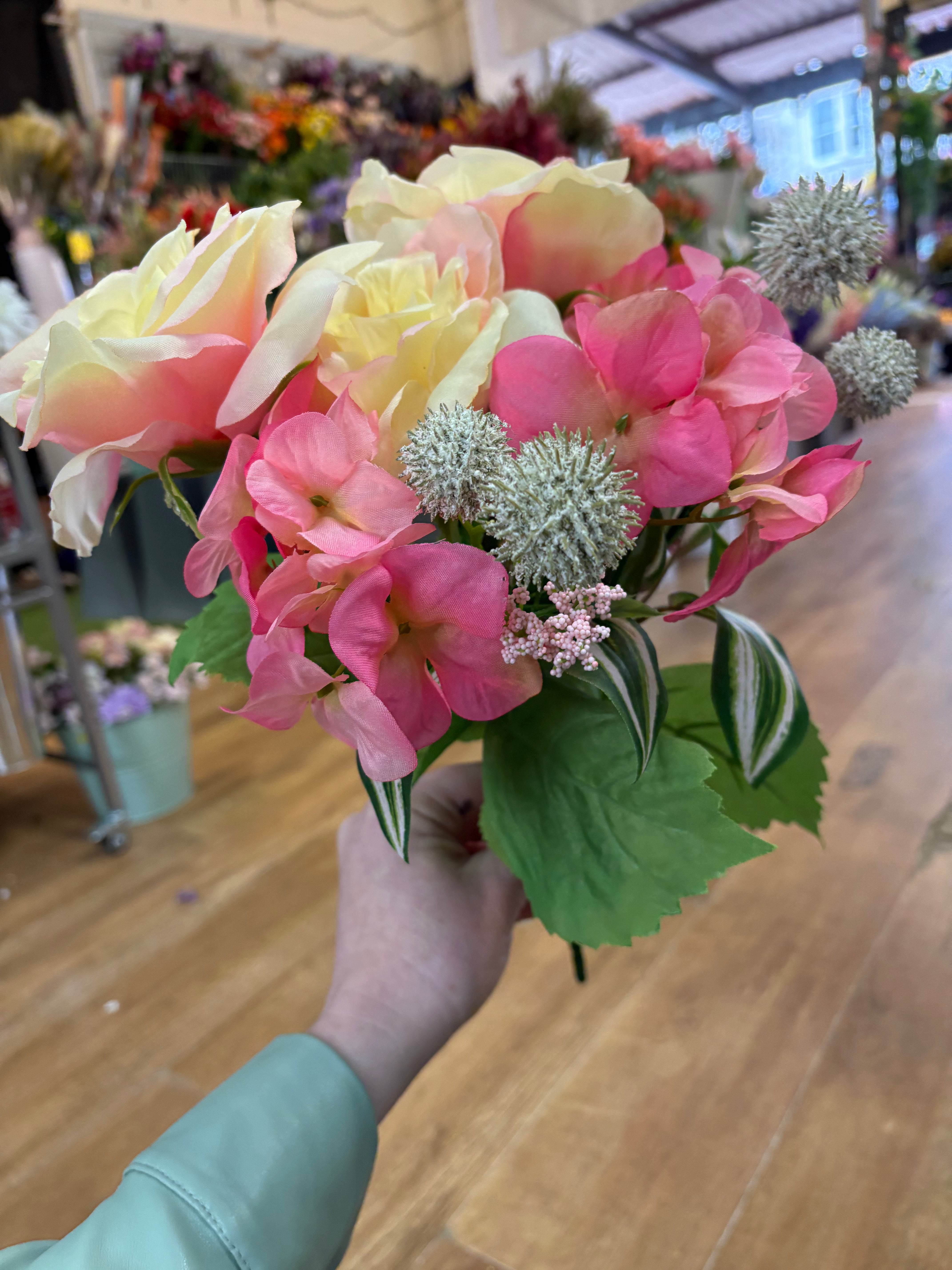 Pink and cream rose, hydrangea and mixed foliage bouquet
