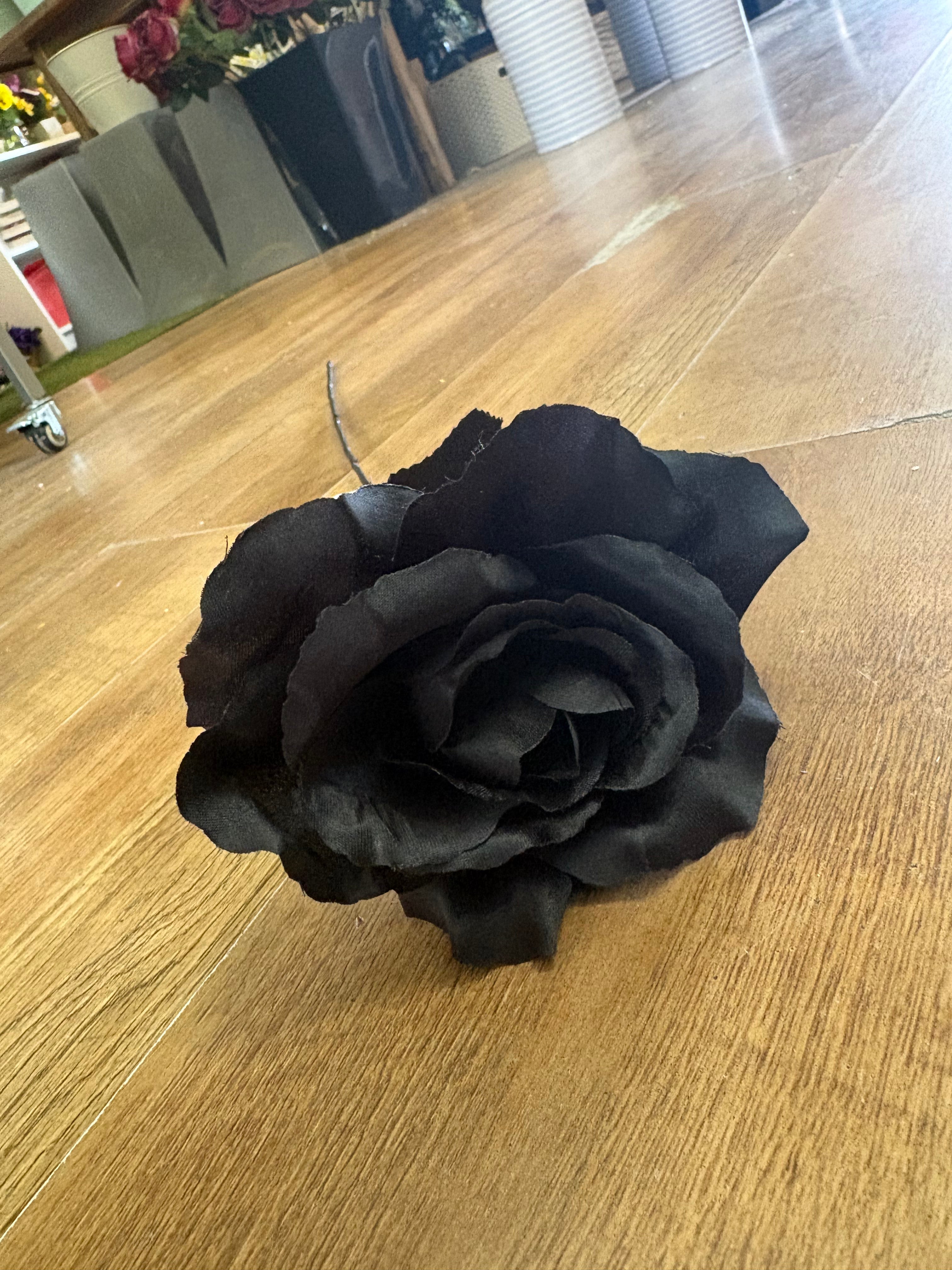 Long stem black open rose