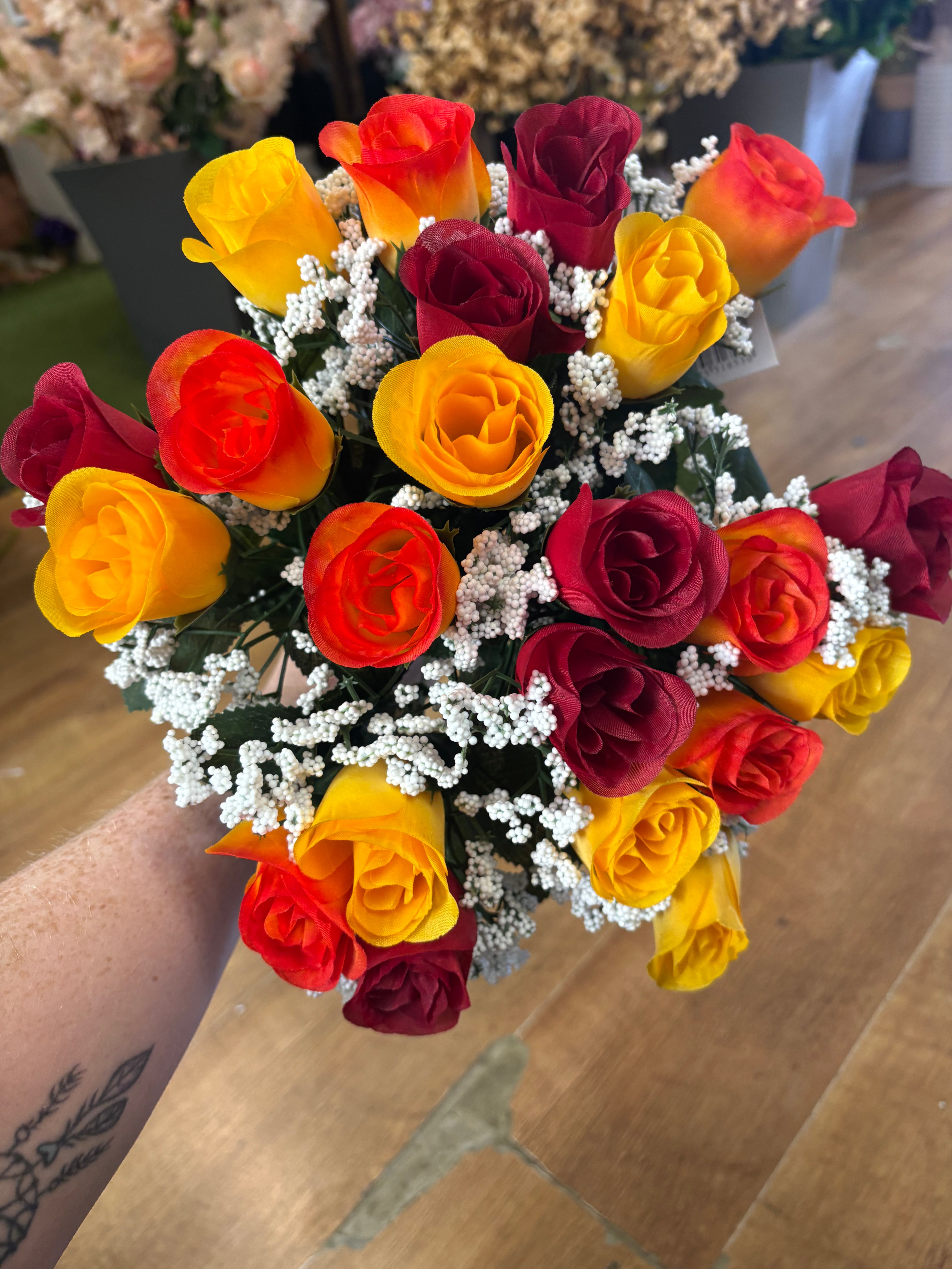 Large 22 head red, orange and yellow rosebud and gypsophila bouquet