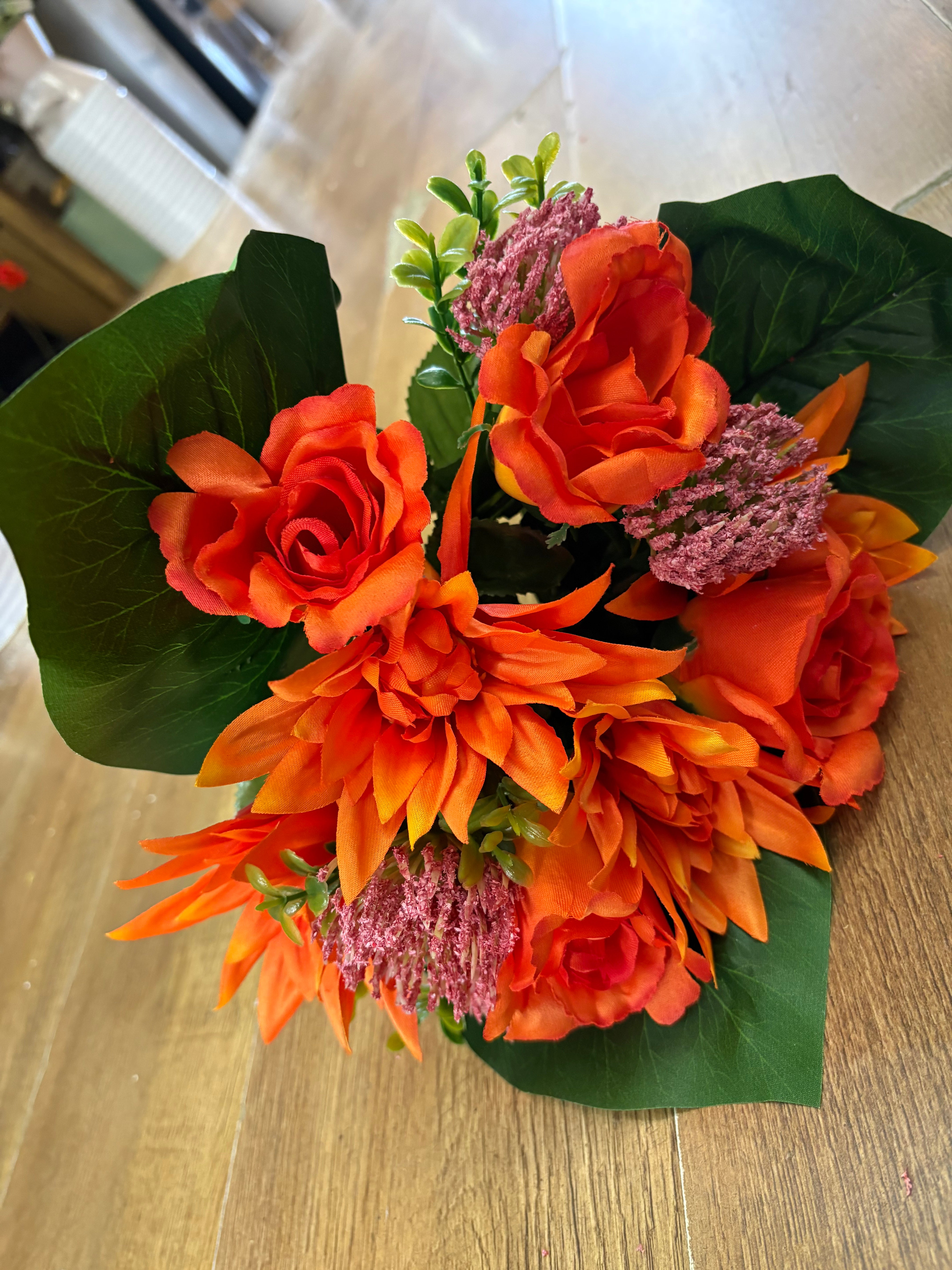 Orange dahlia, rose and flocked protea bouquet