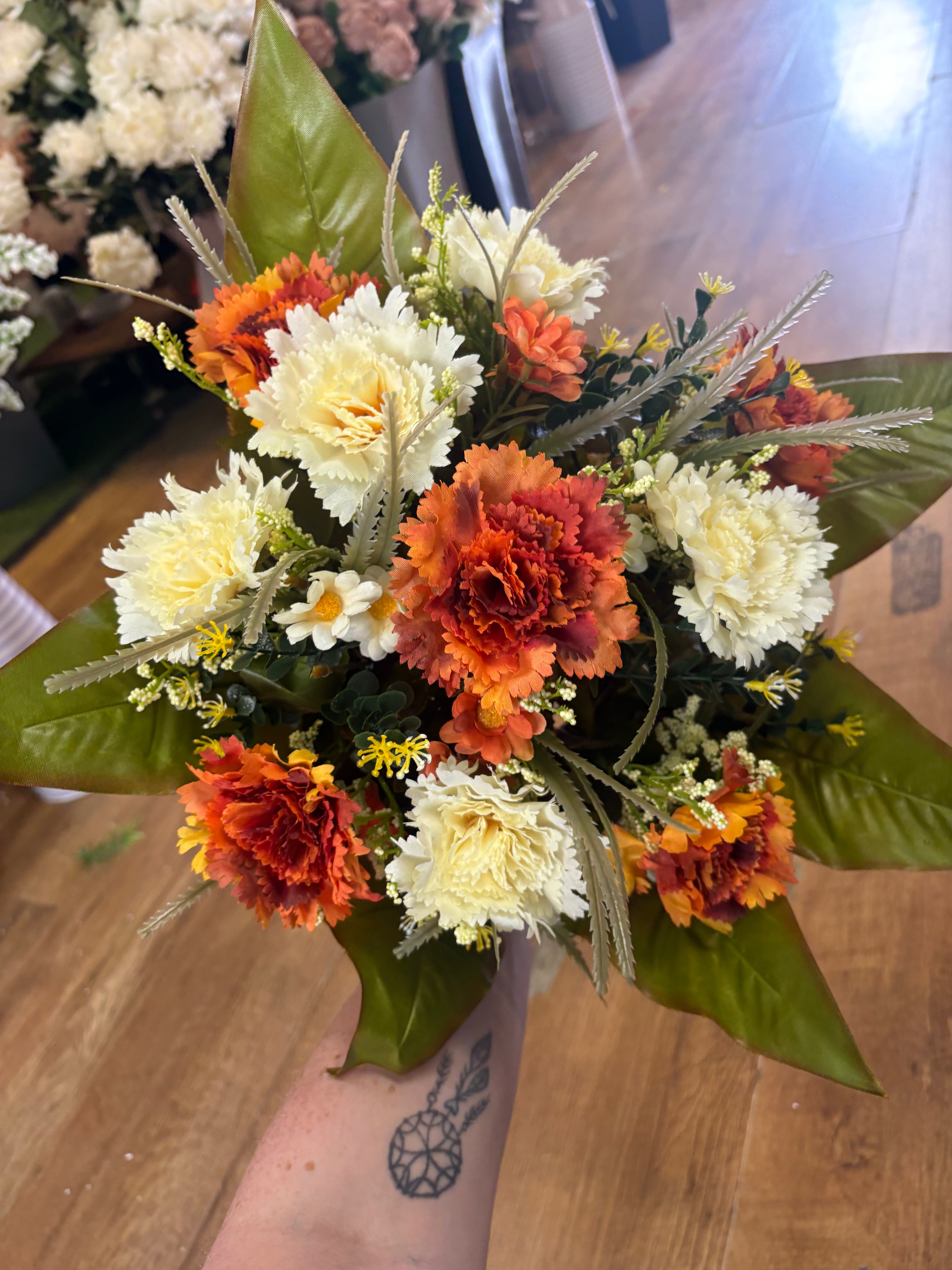 Large burnt orange and cream carnation and mixed foliage Bouquet