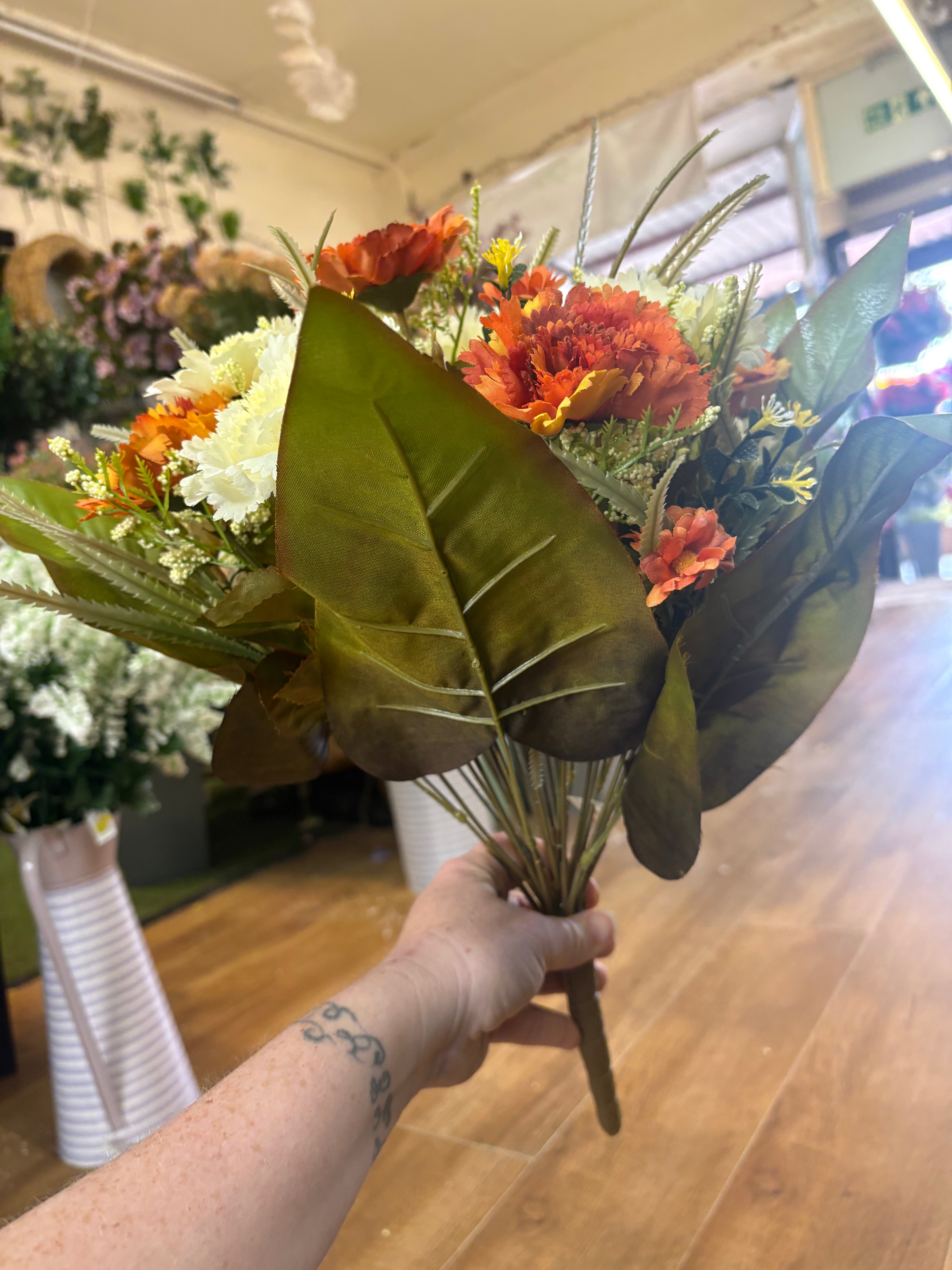 Large burnt orange and cream carnation and mixed foliage Bouquet
