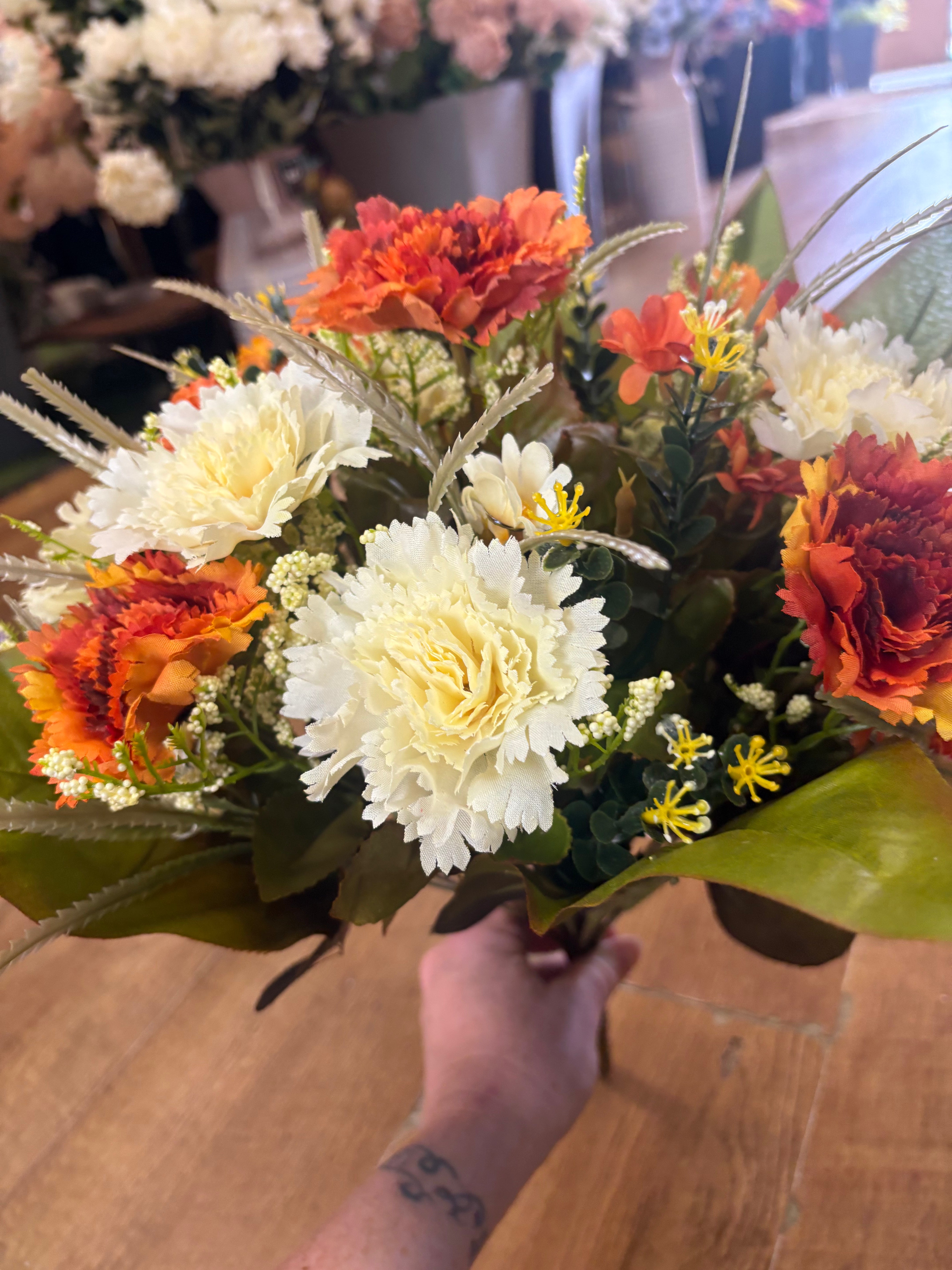 Large burnt orange and cream carnation and mixed foliage Bouquet