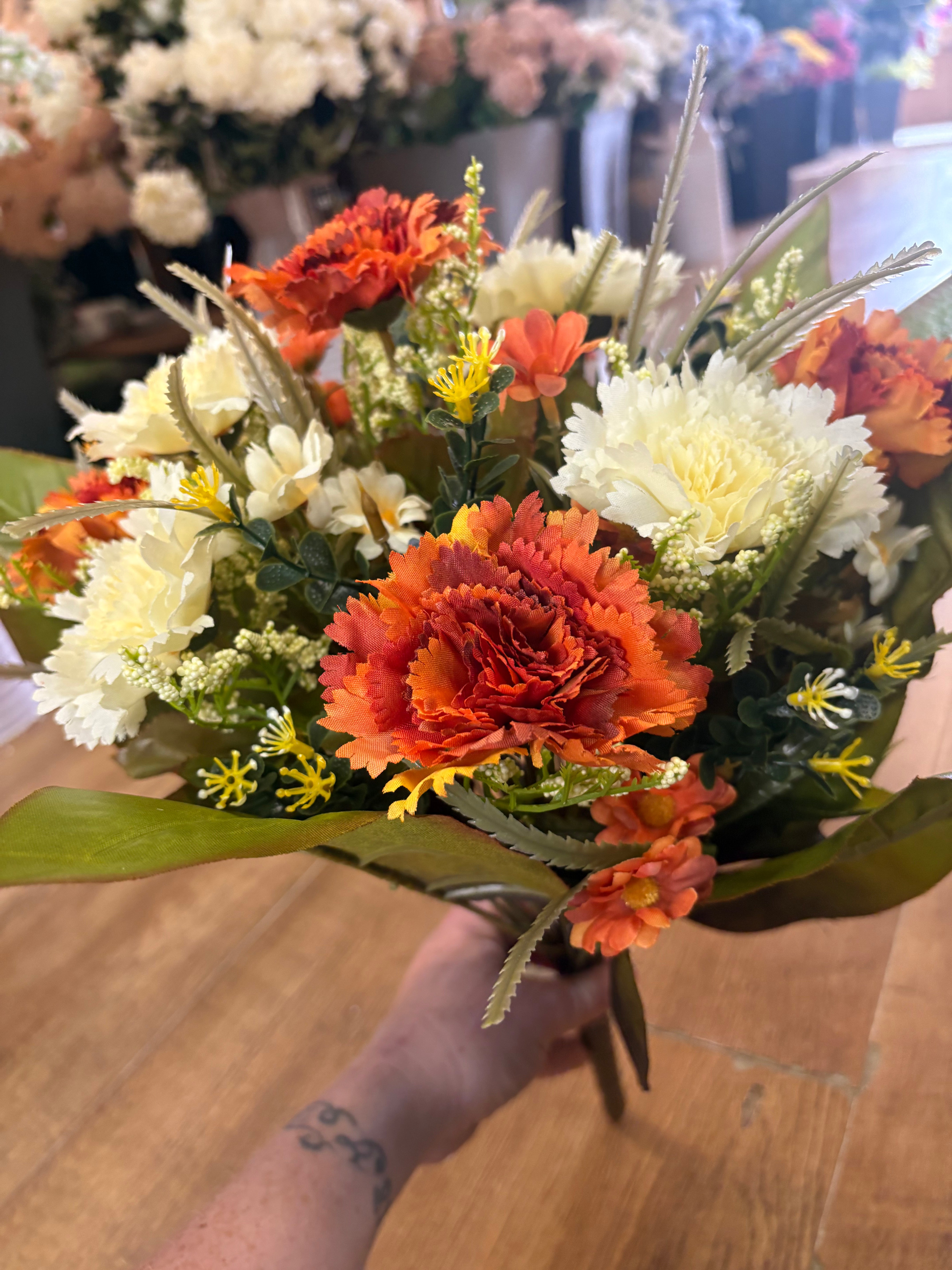 Large burnt orange and cream carnation and mixed foliage Bouquet