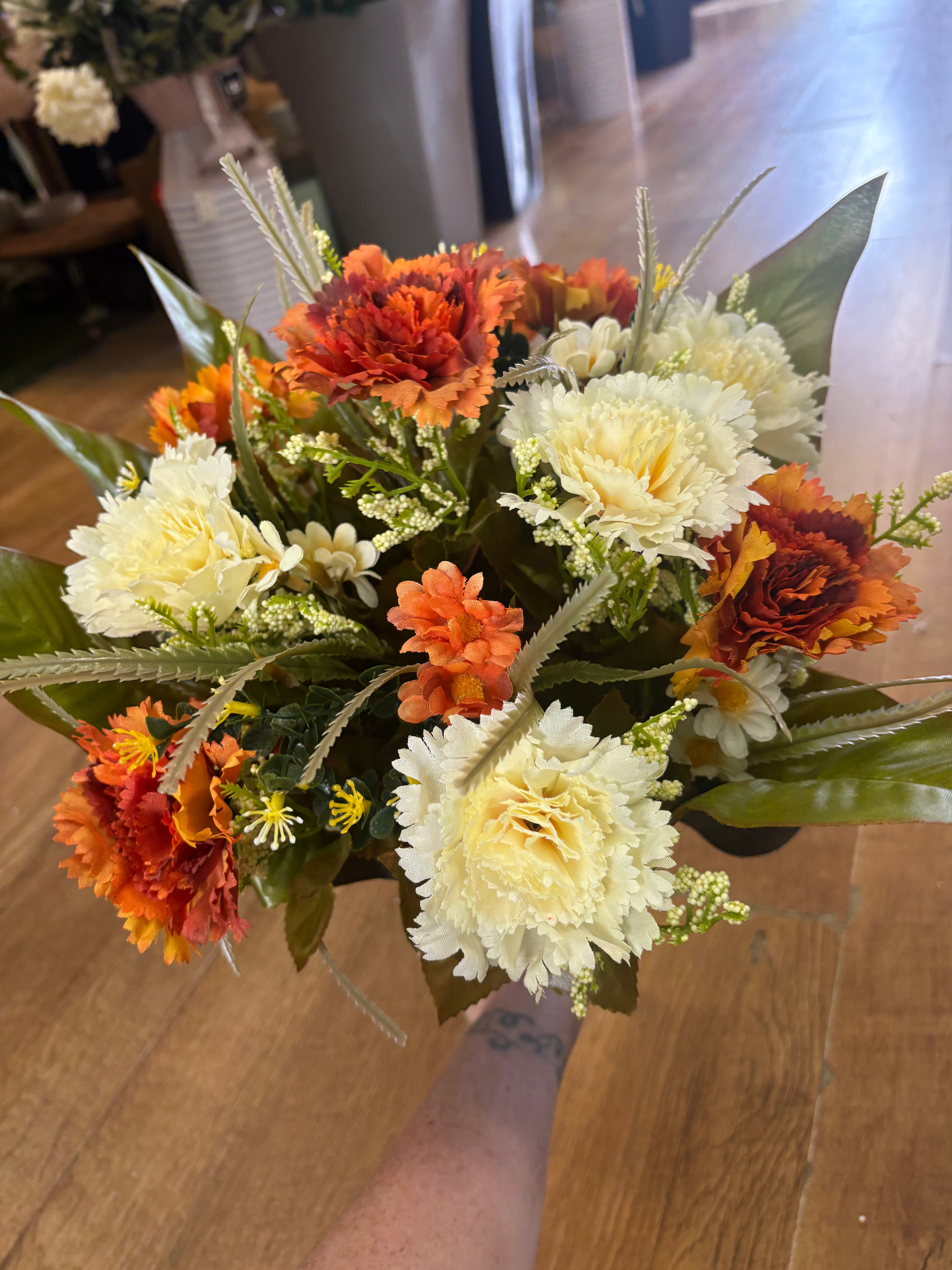 Large burnt orange and cream carnation and mixed foliage Bouquet
