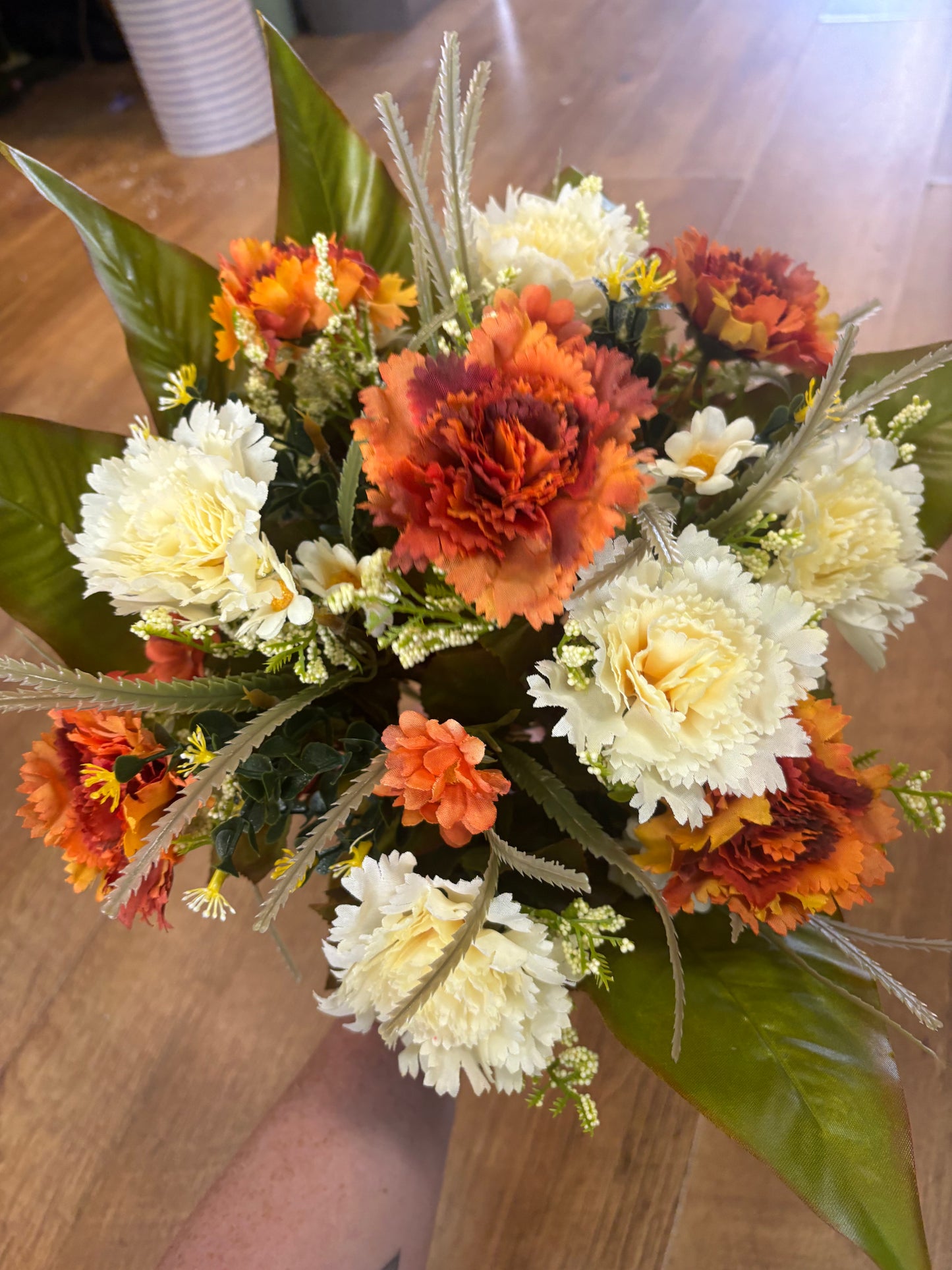 Large burnt orange and cream carnation and mixed foliage Bouquet