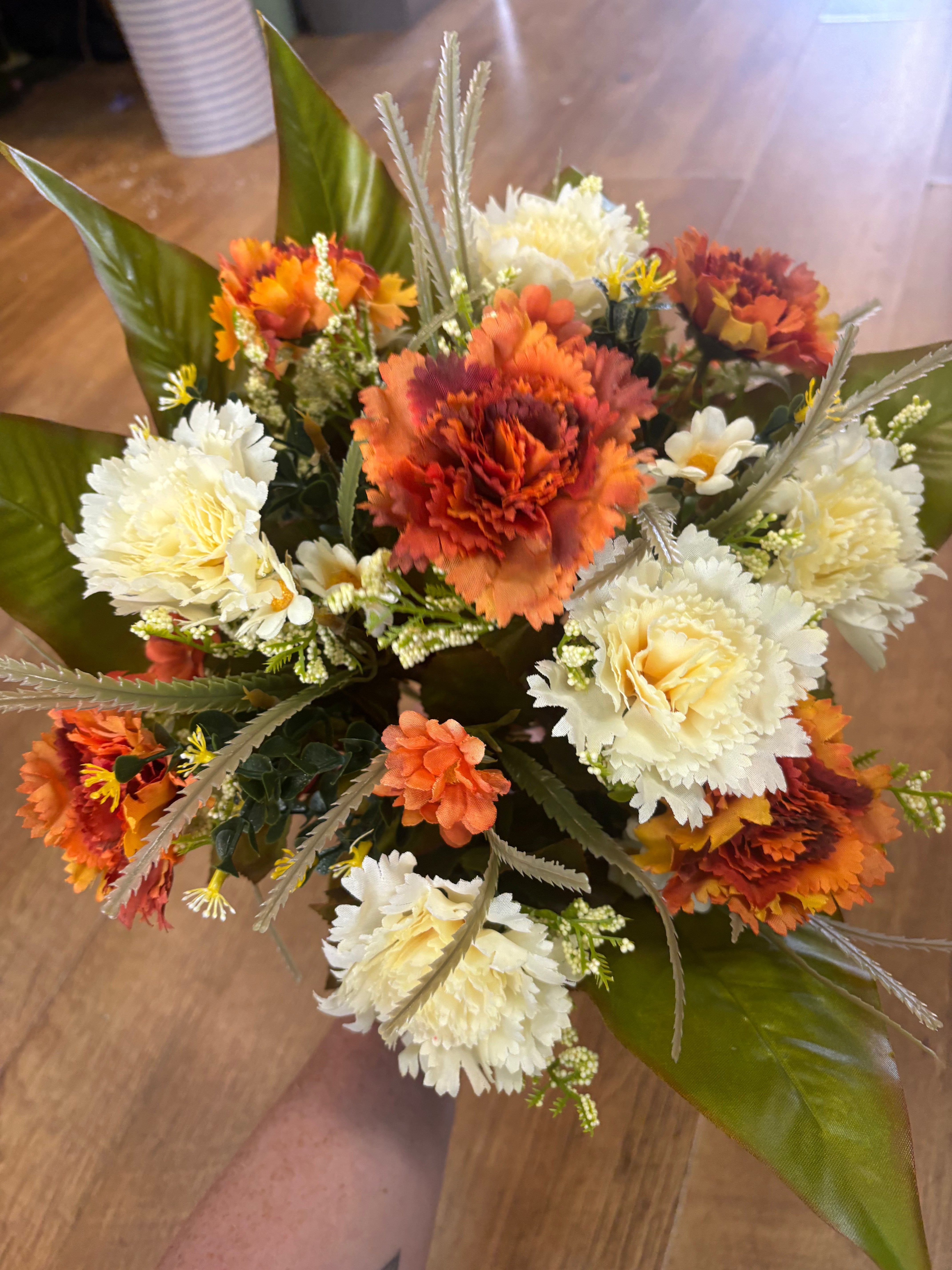 Large burnt orange and cream carnation and mixed foliage Bouquet